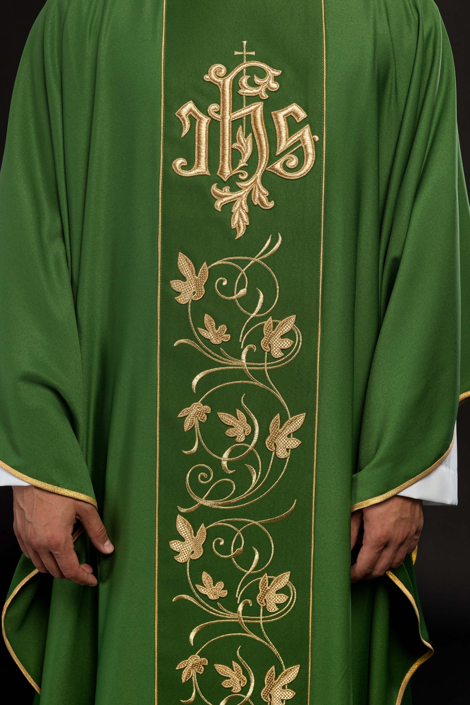 Green liturgical chasuble with richly decorated belt with floral motif and IHS