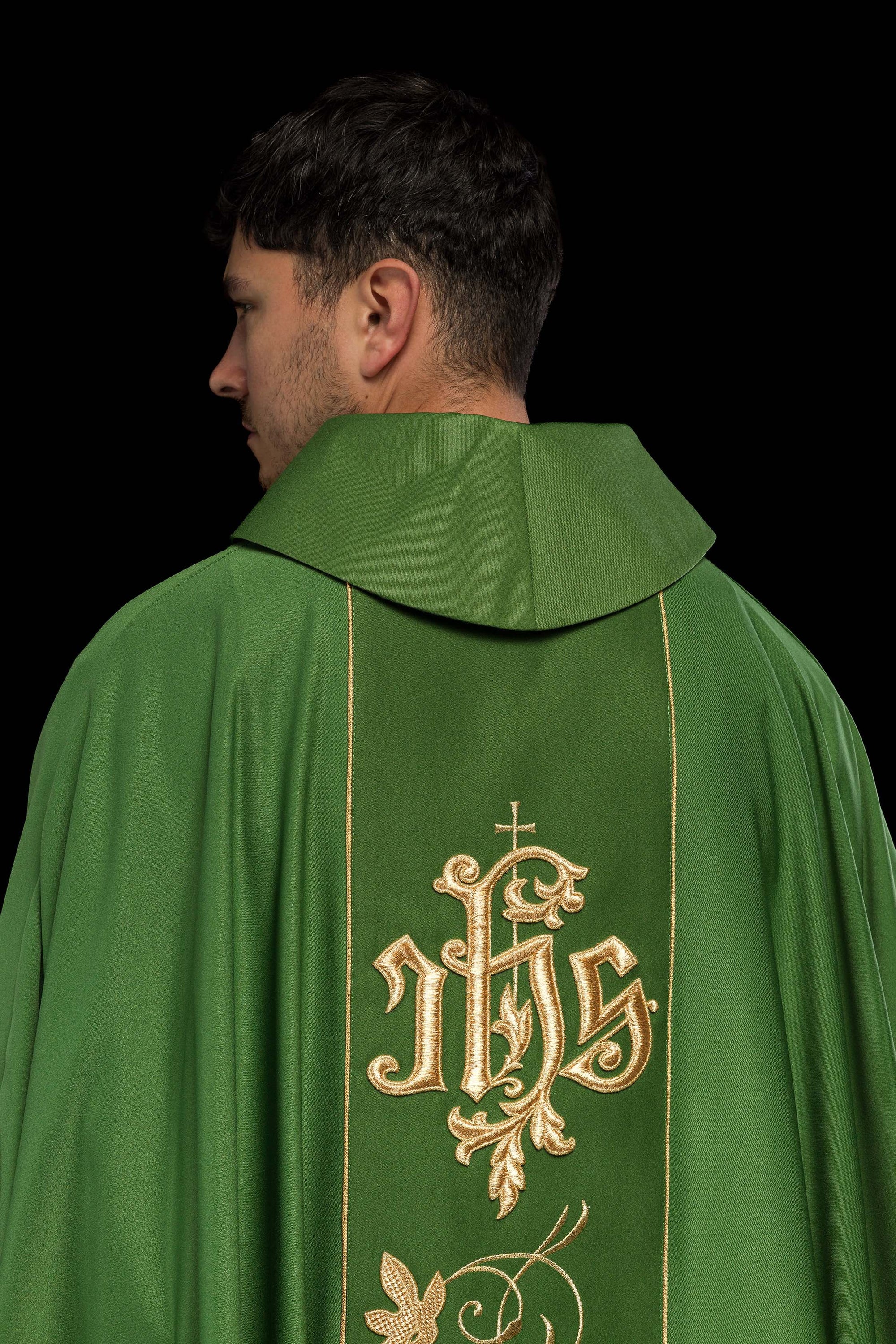 Green liturgical chasuble with richly decorated belt with floral motif and IHS