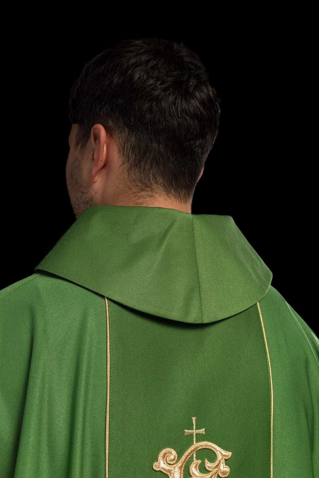 Green liturgical chasuble with richly decorated belt with floral motif and IHS