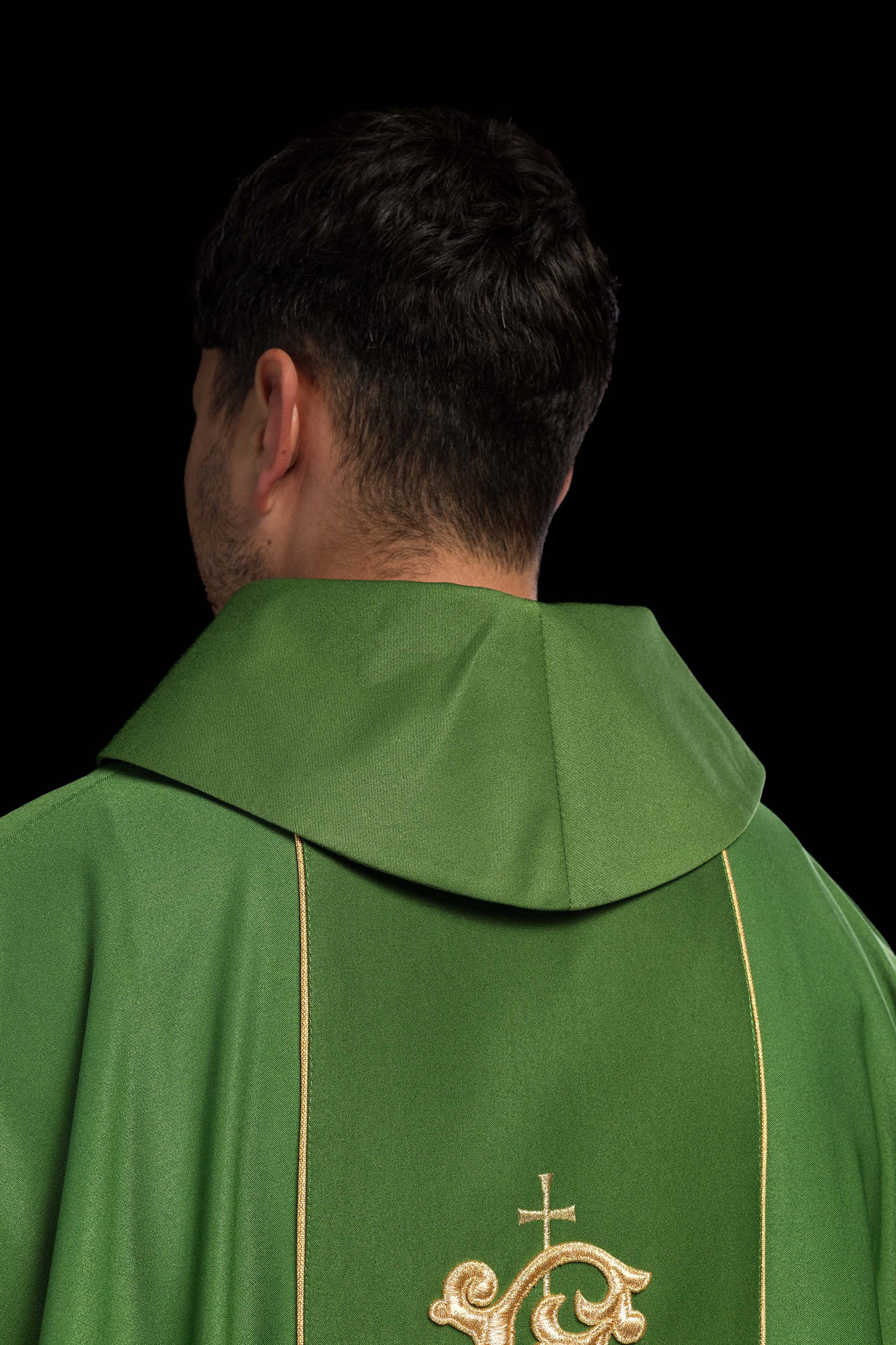 Green liturgical chasuble with richly decorated belt with floral motif and IHS