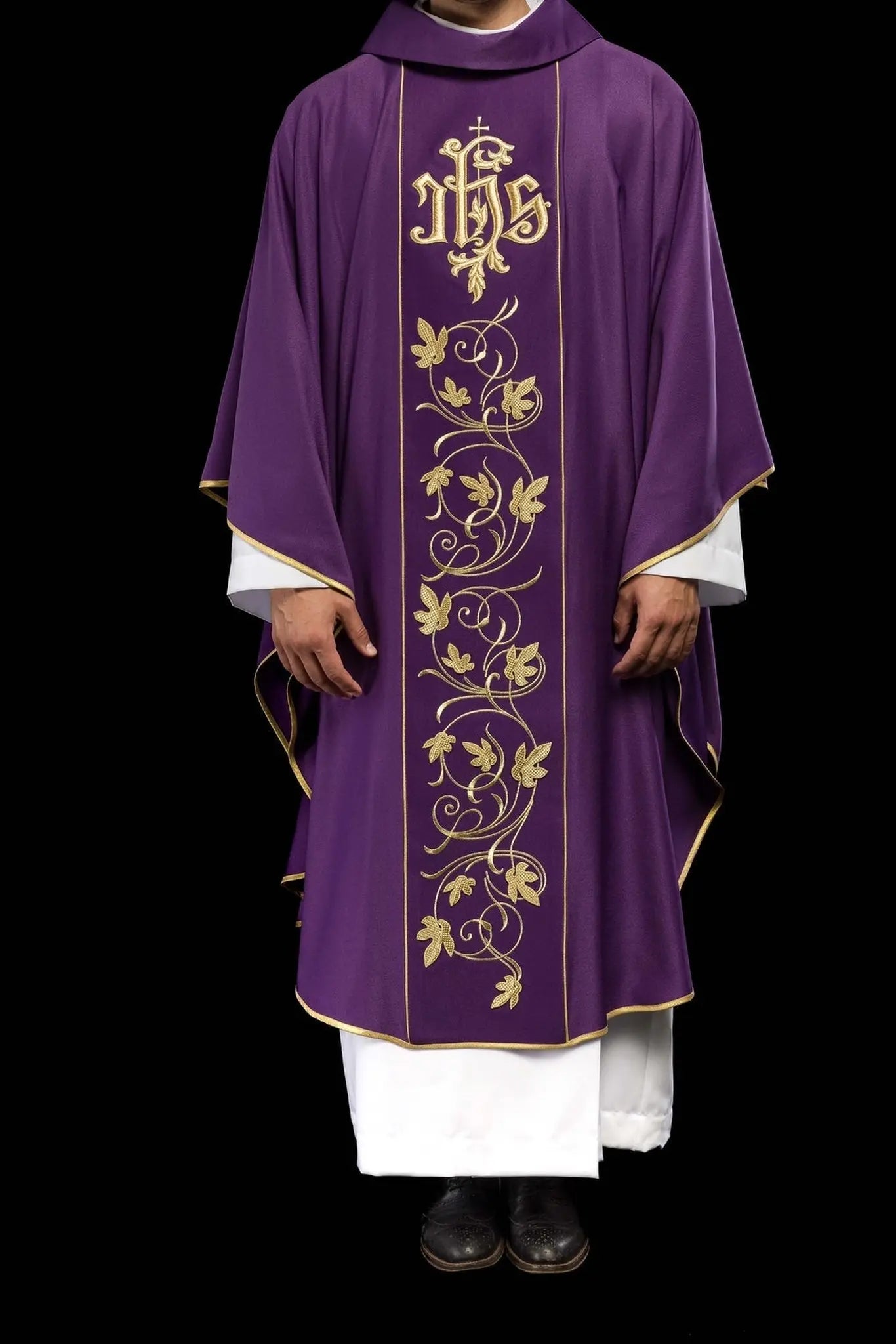 Purple liturgical chasuble with richly decorated belt with floral motif and IHS
