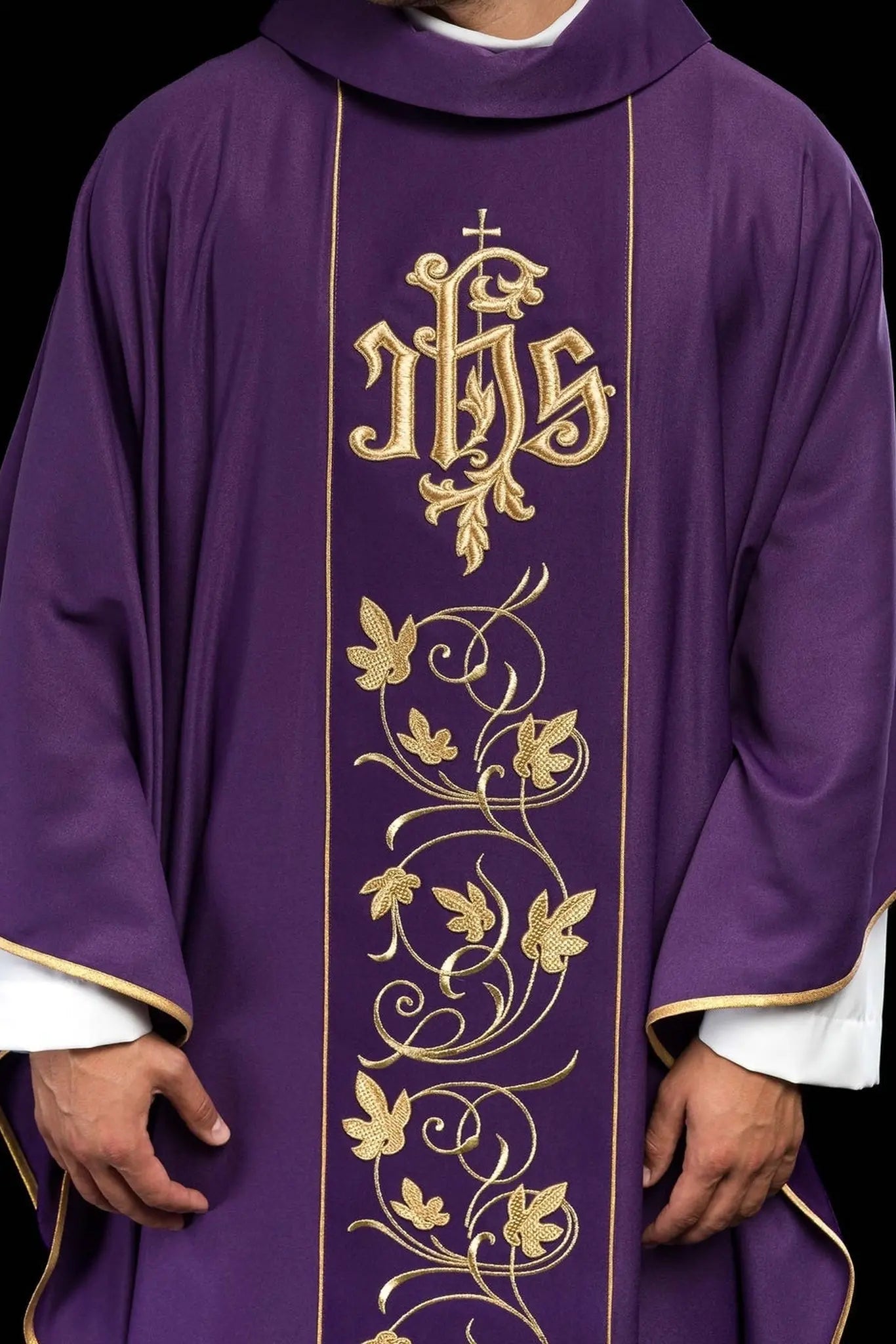 Purple liturgical chasuble with richly decorated belt with floral motif and IHS