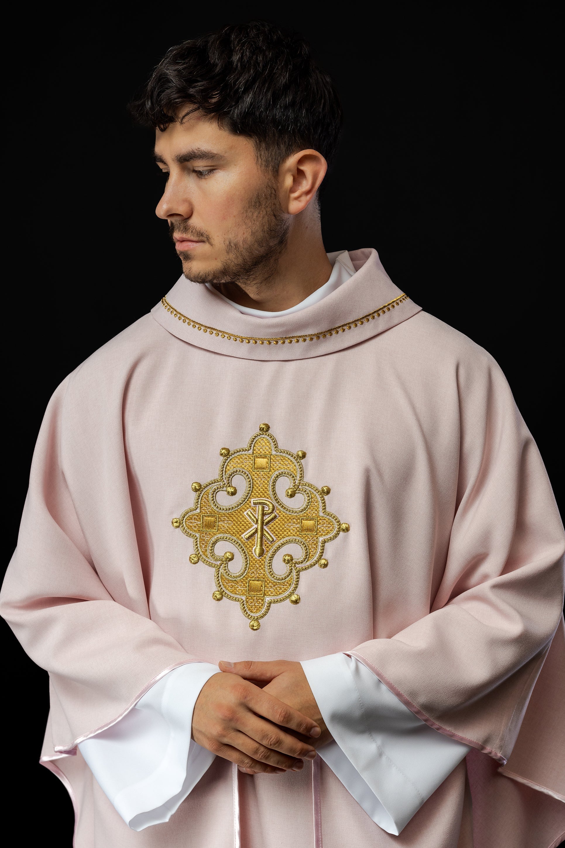 Chasuble with embroidered cross and gold trim on collar in rose color