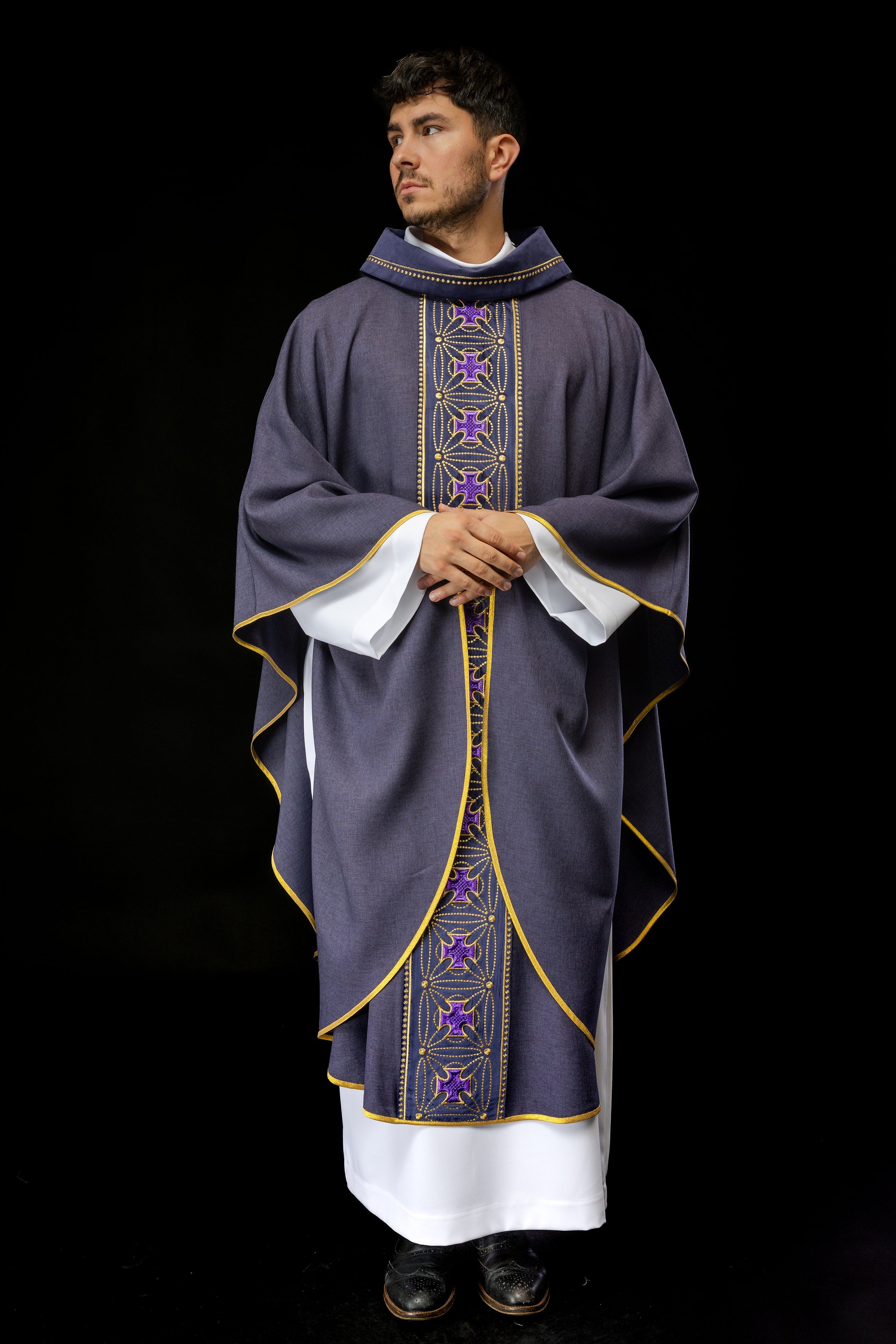 Liturgical chasuble with richly decorated belt with crosses in purple color