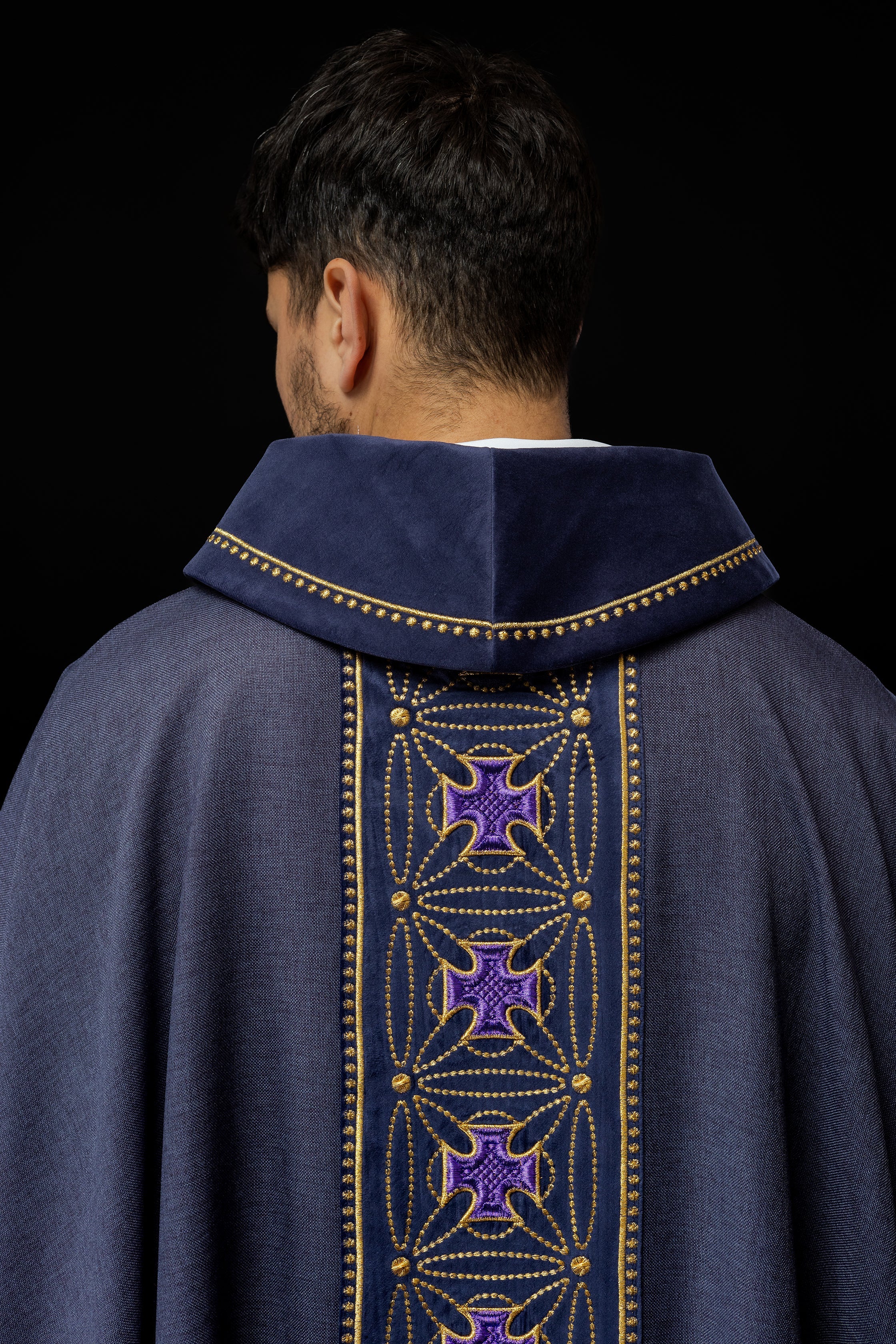 Liturgical chasuble with richly decorated belt with crosses in purple color