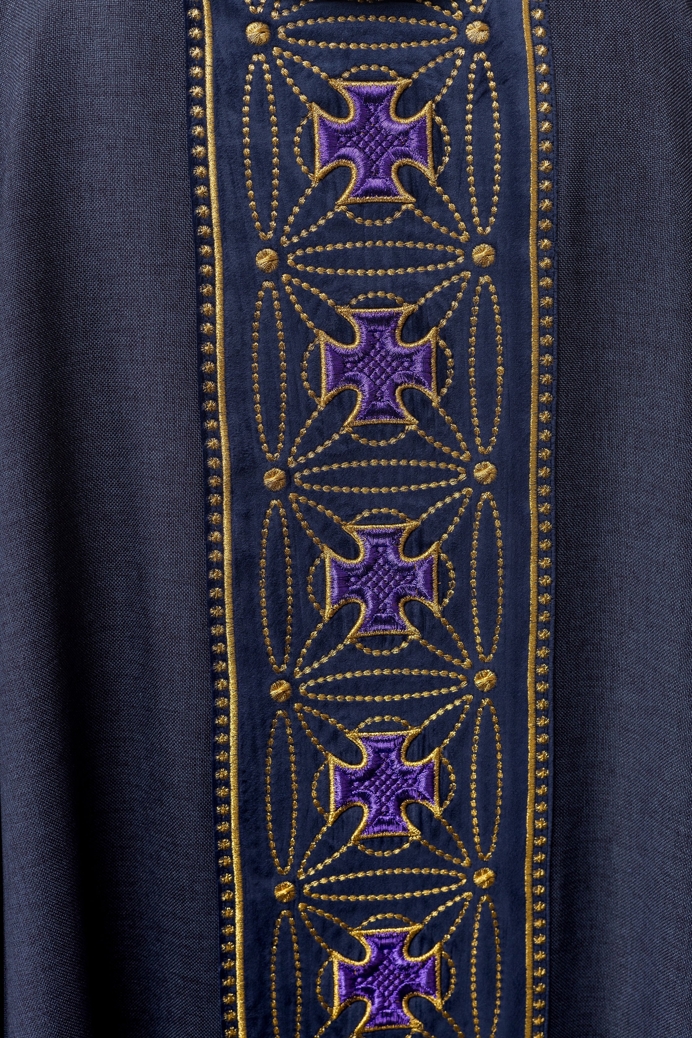 Liturgical chasuble with richly decorated belt with crosses in purple color