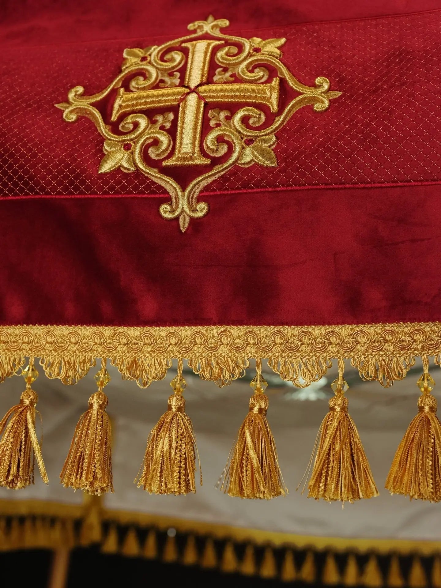 Embroidered canopy on burgundy velvet