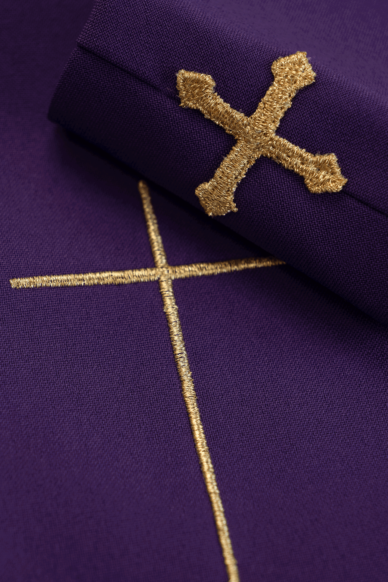 Richly decorated purple chasuble with gold motif and wide IHS band