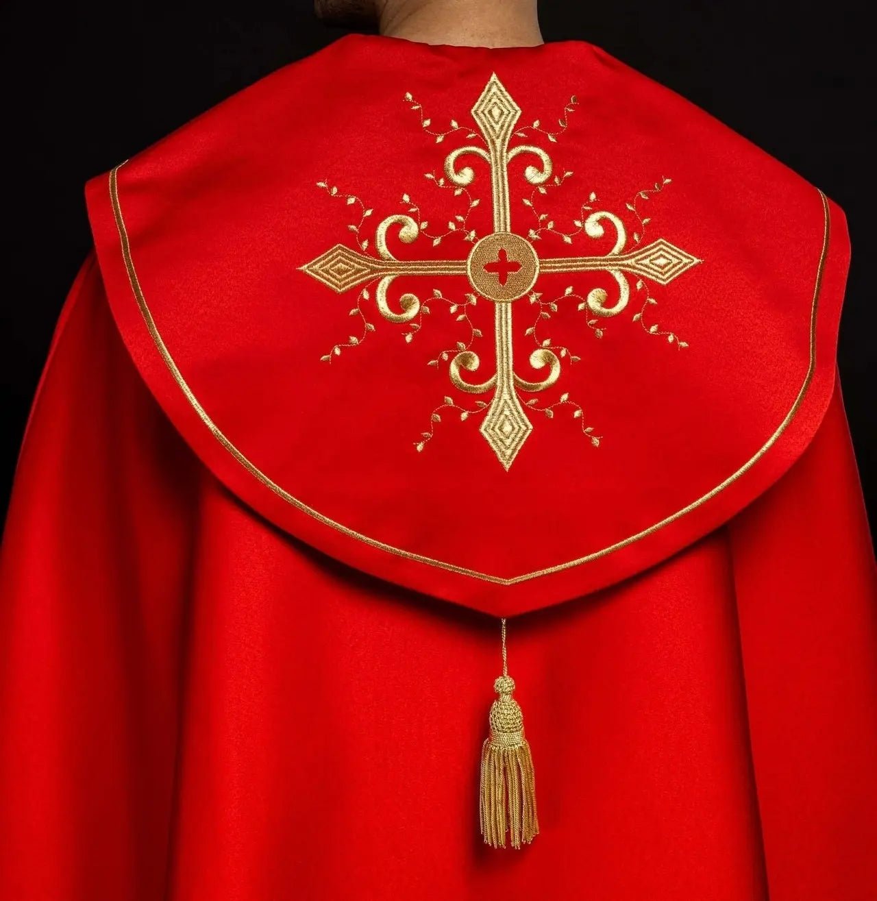 Red liturgical cope with gold crosses embroidery