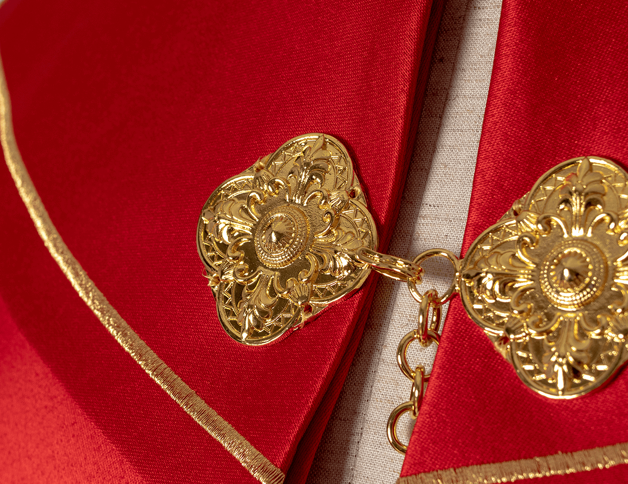 Red liturgical cope with gold crosses embroidery