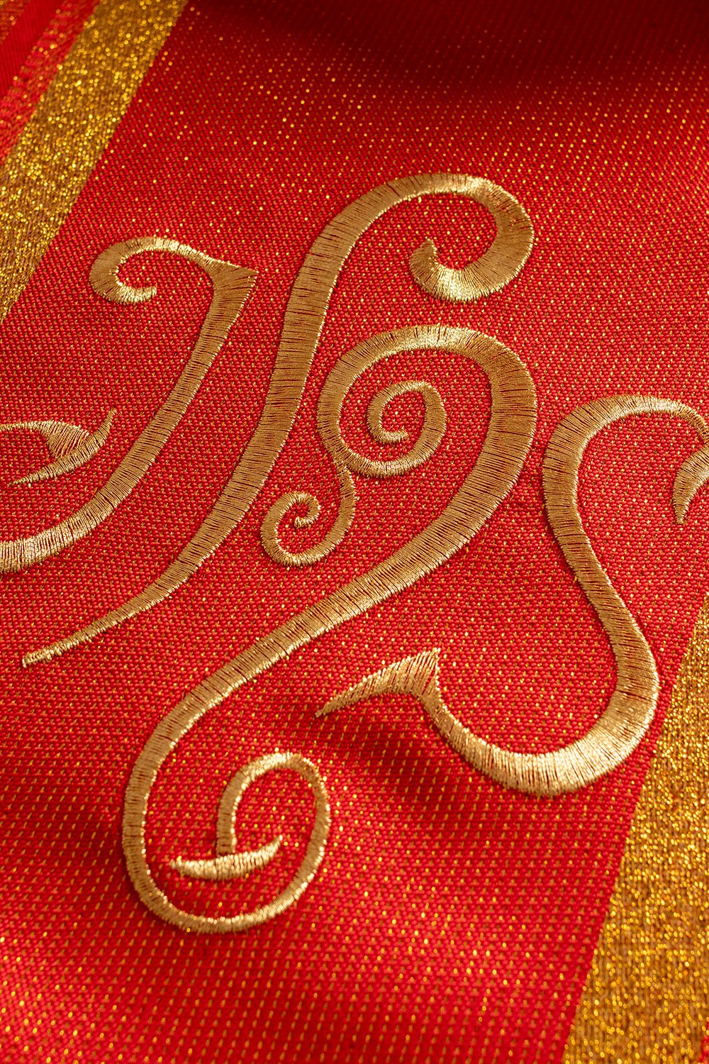 Red embroidered chasuble with IHS design with gilding