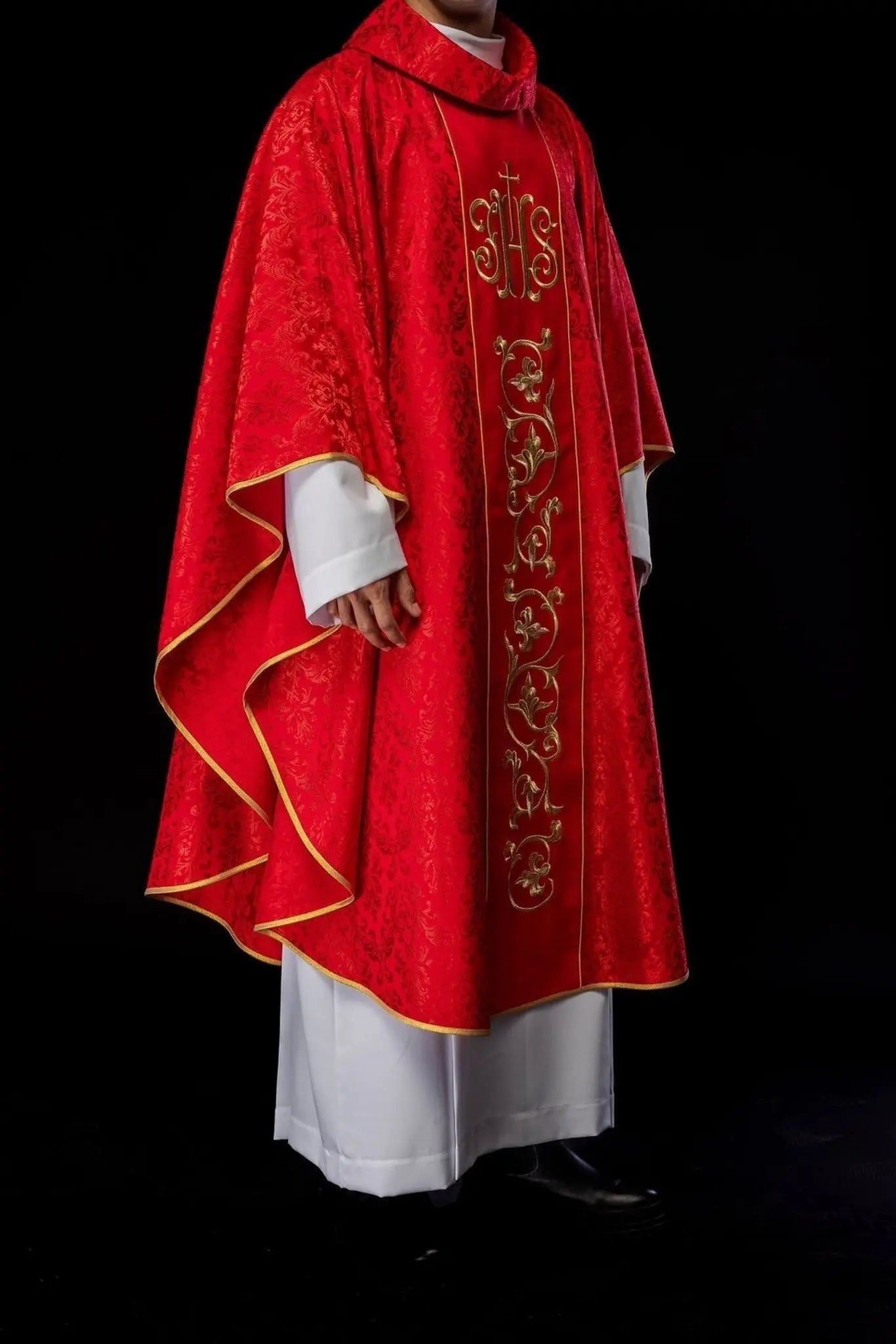 Red liturgical chasuble with richly decorated IHS belt
