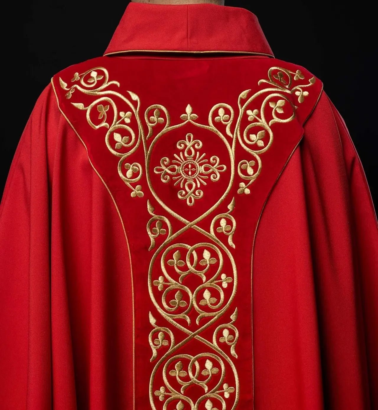 Red liturgical chasuble decorated with embroidery on velvet