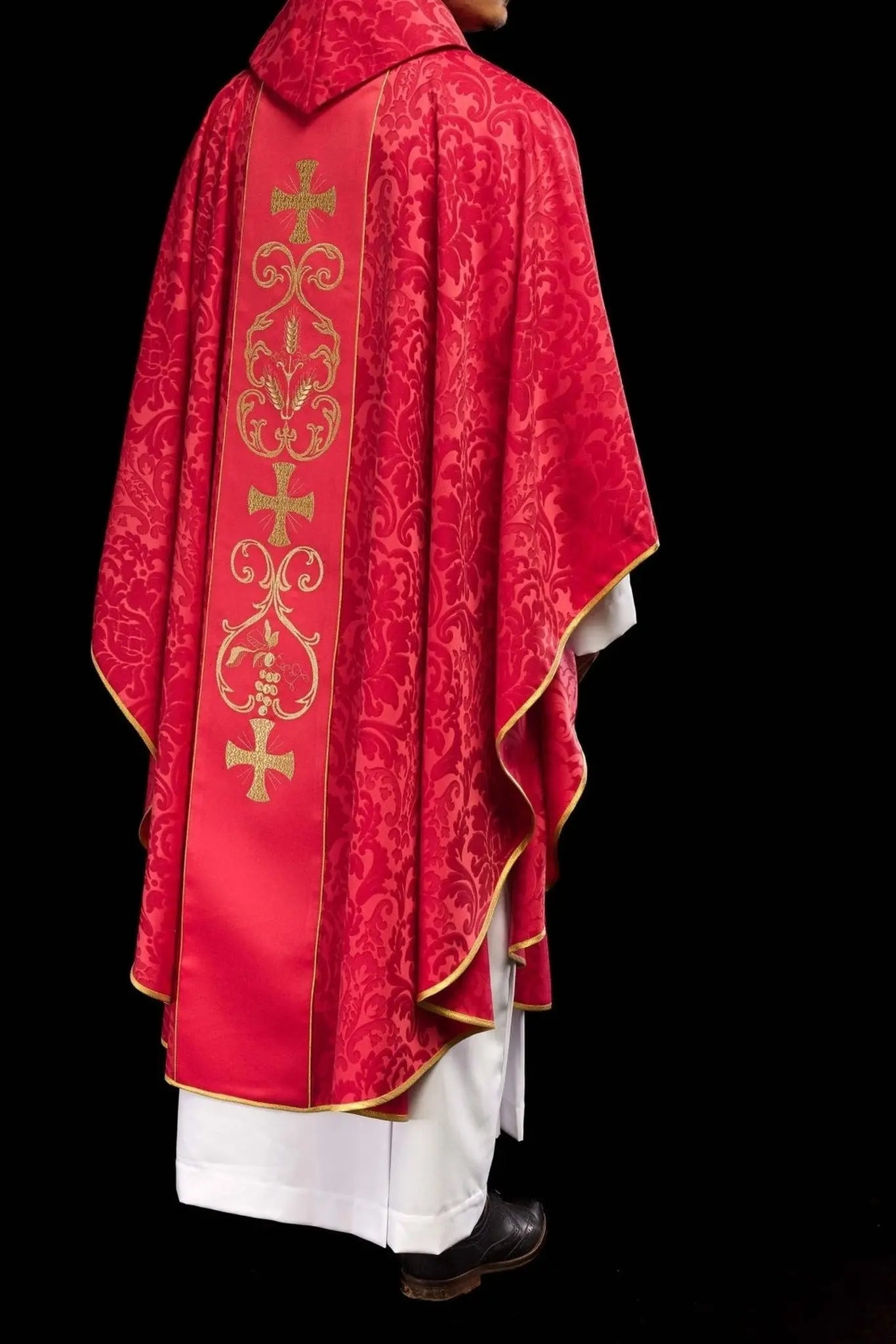 Red liturgical chasuble decorated with embroidered belt