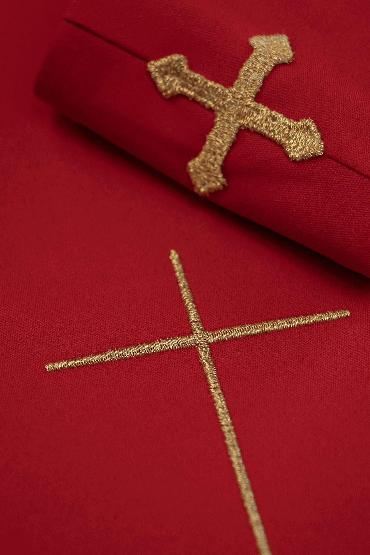 Red liturgical chasuble decorated with gold embroidered belt