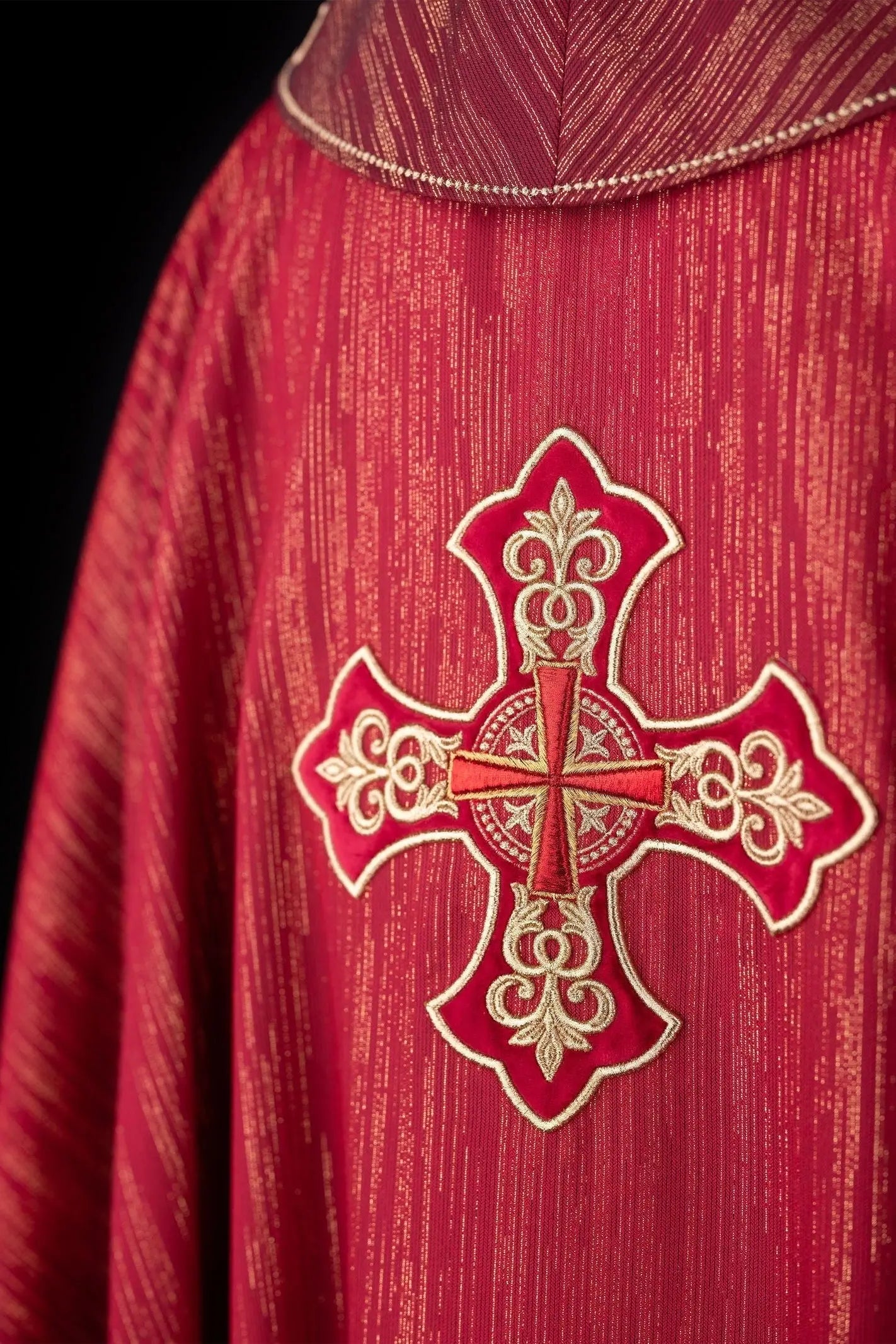 Red chasuble with embroidered cross motif on decor