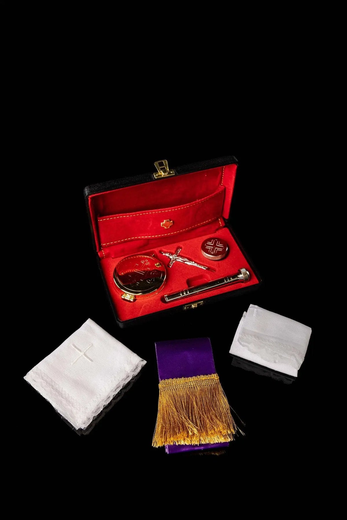 Red liturgical equipment burse with ciborium set, open view with linens and purple stole