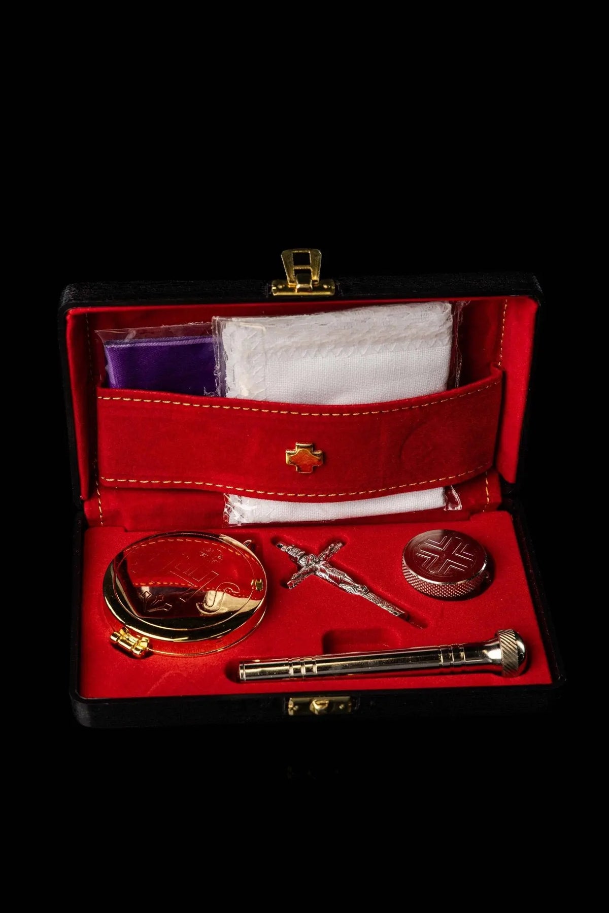Red liturgical equipment burse with IHS ciborium, front open view with fitted accessories