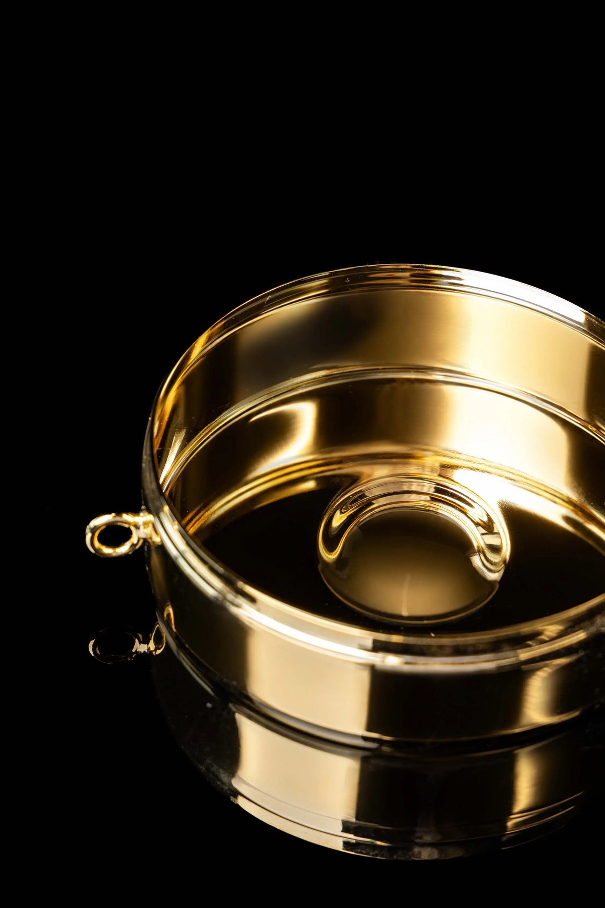 Gold-plated ciborium with engraved IHS, open interior view
