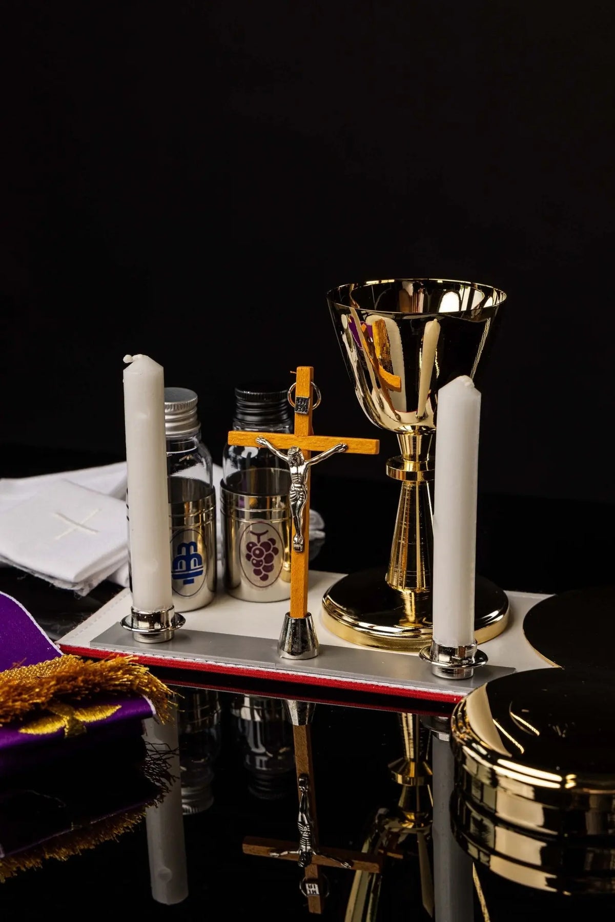 Mission case liturgical equipment set, chalice, candles, crucifix and bottles
