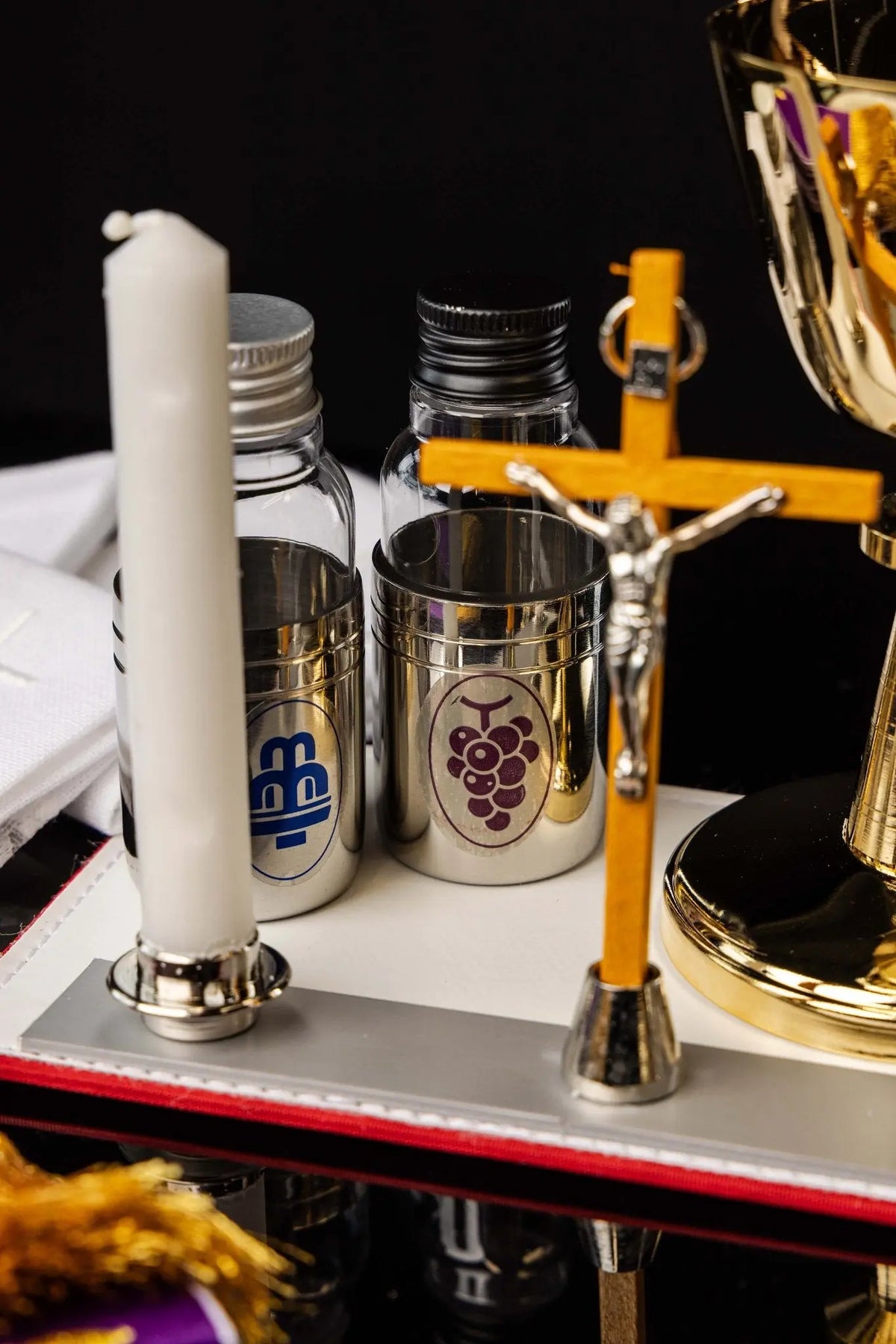 Mission case liturgical equipment set, bottles and crucifix close-up