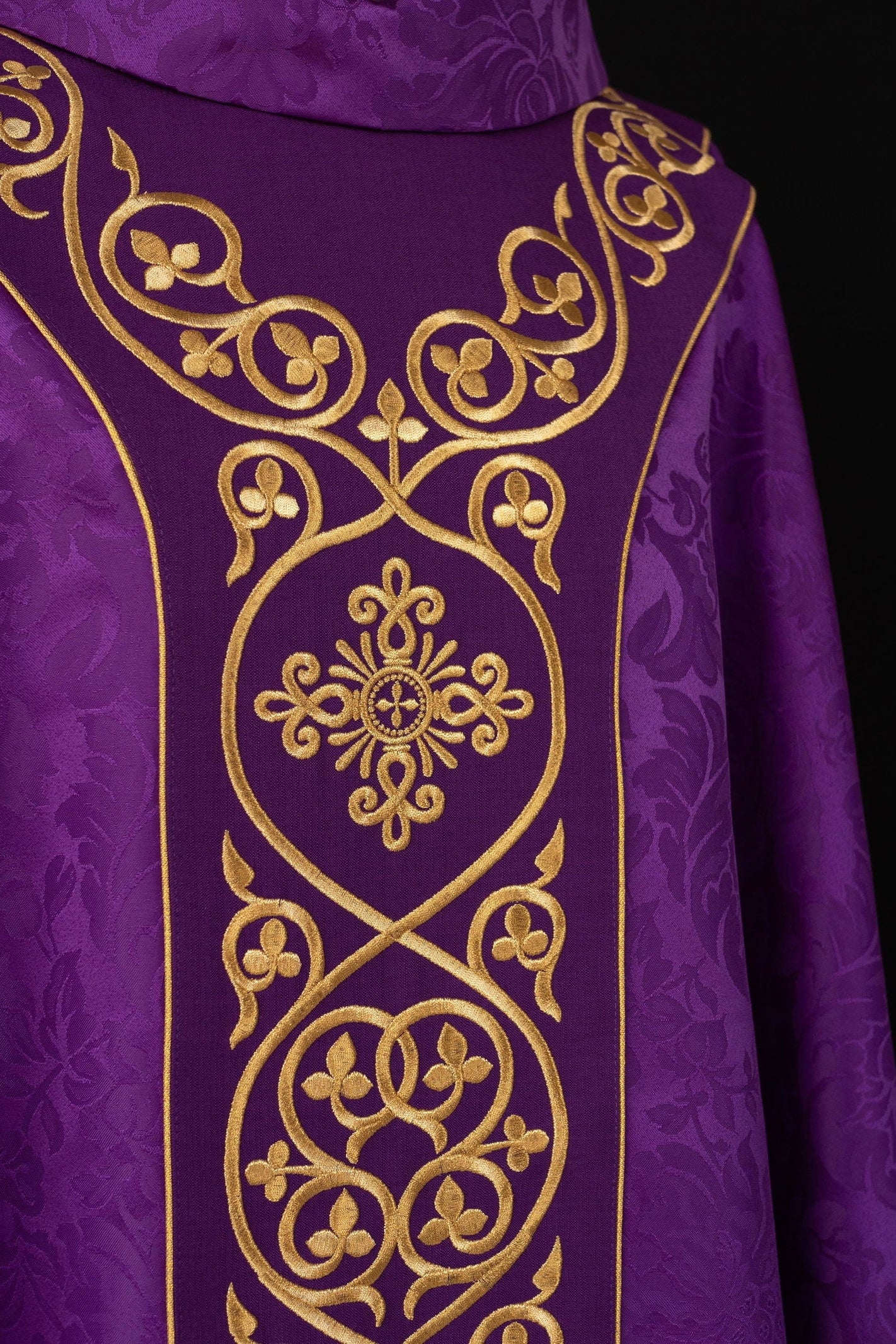 Purple liturgical chasuble decorated with embroidered velvet belt