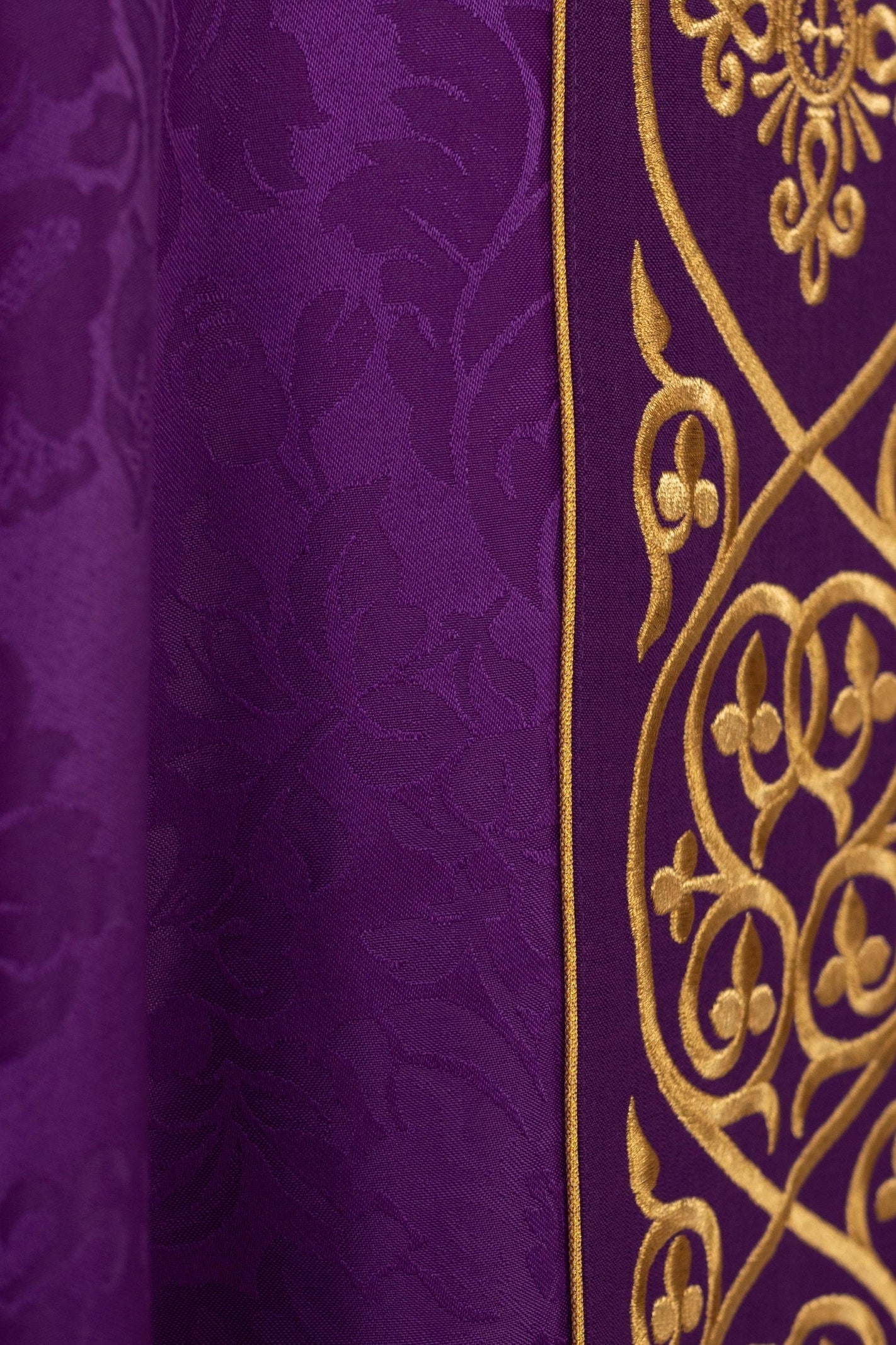 Purple liturgical chasuble decorated with embroidered velvet belt