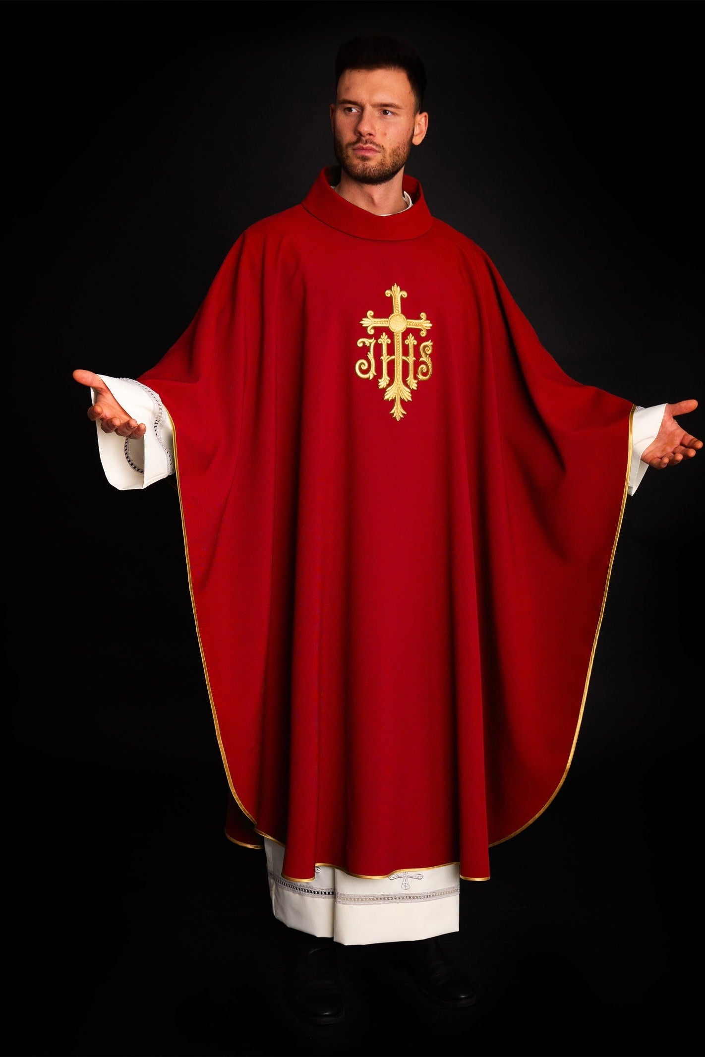 Embroidered red chasuble with JHS symbol