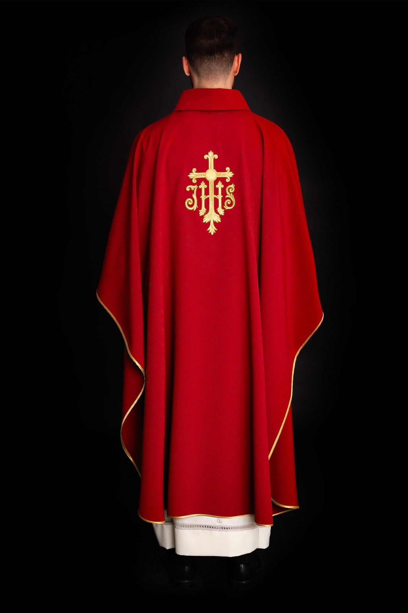 Embroidered red chasuble with JHS symbol