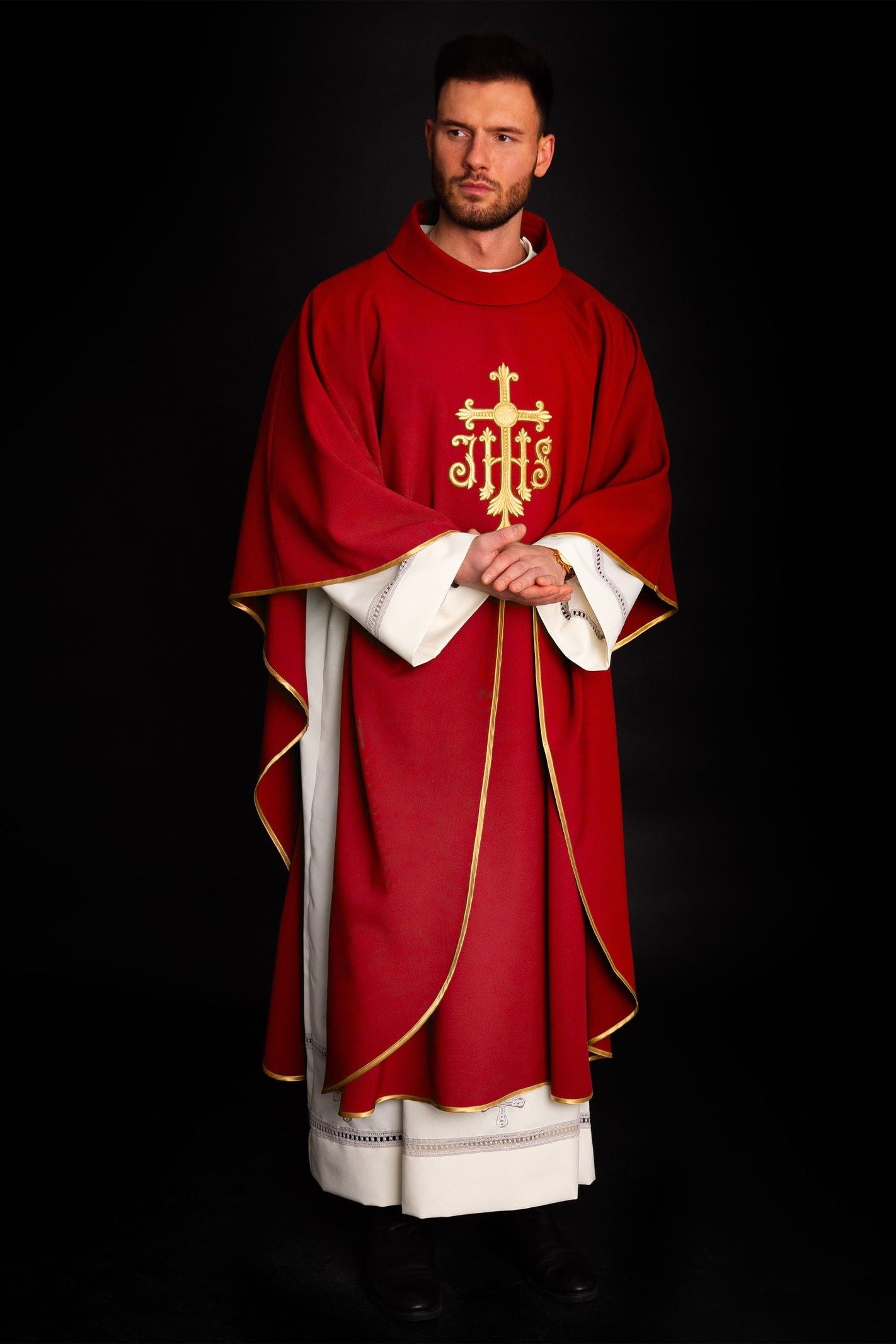 Embroidered red chasuble with JHS symbol