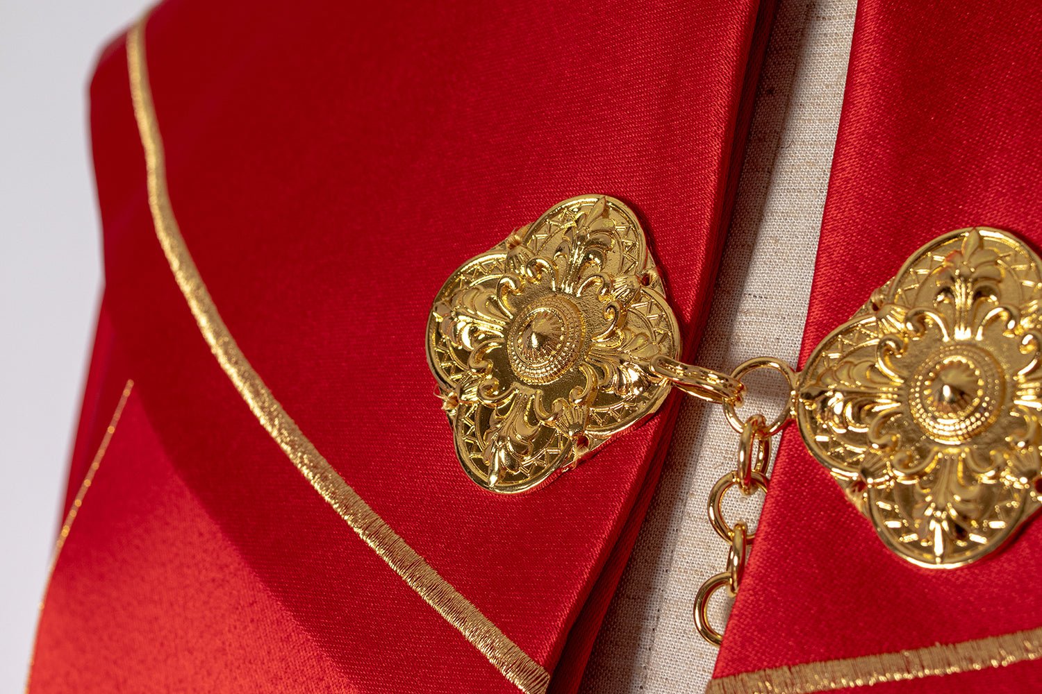 Eucharistic cape with richly decorated monogram in red