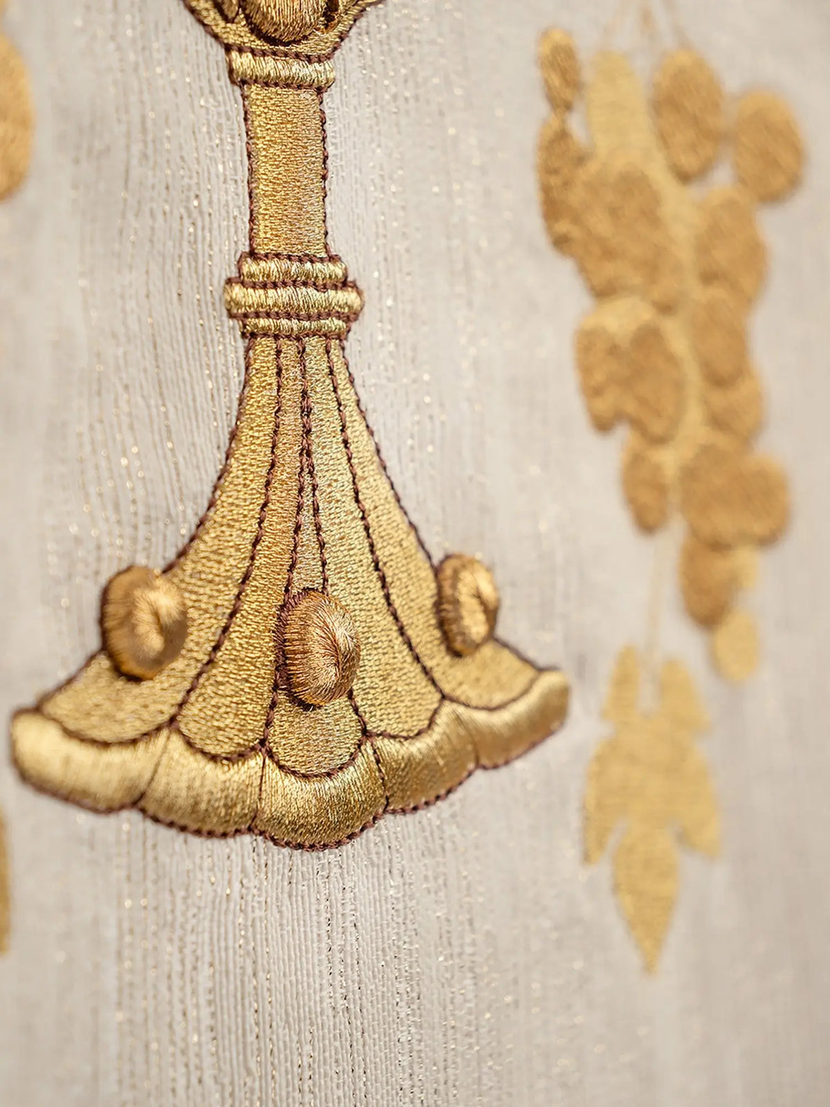 Ecru chasuble with chalice and vine embroidery, chalice base close-up