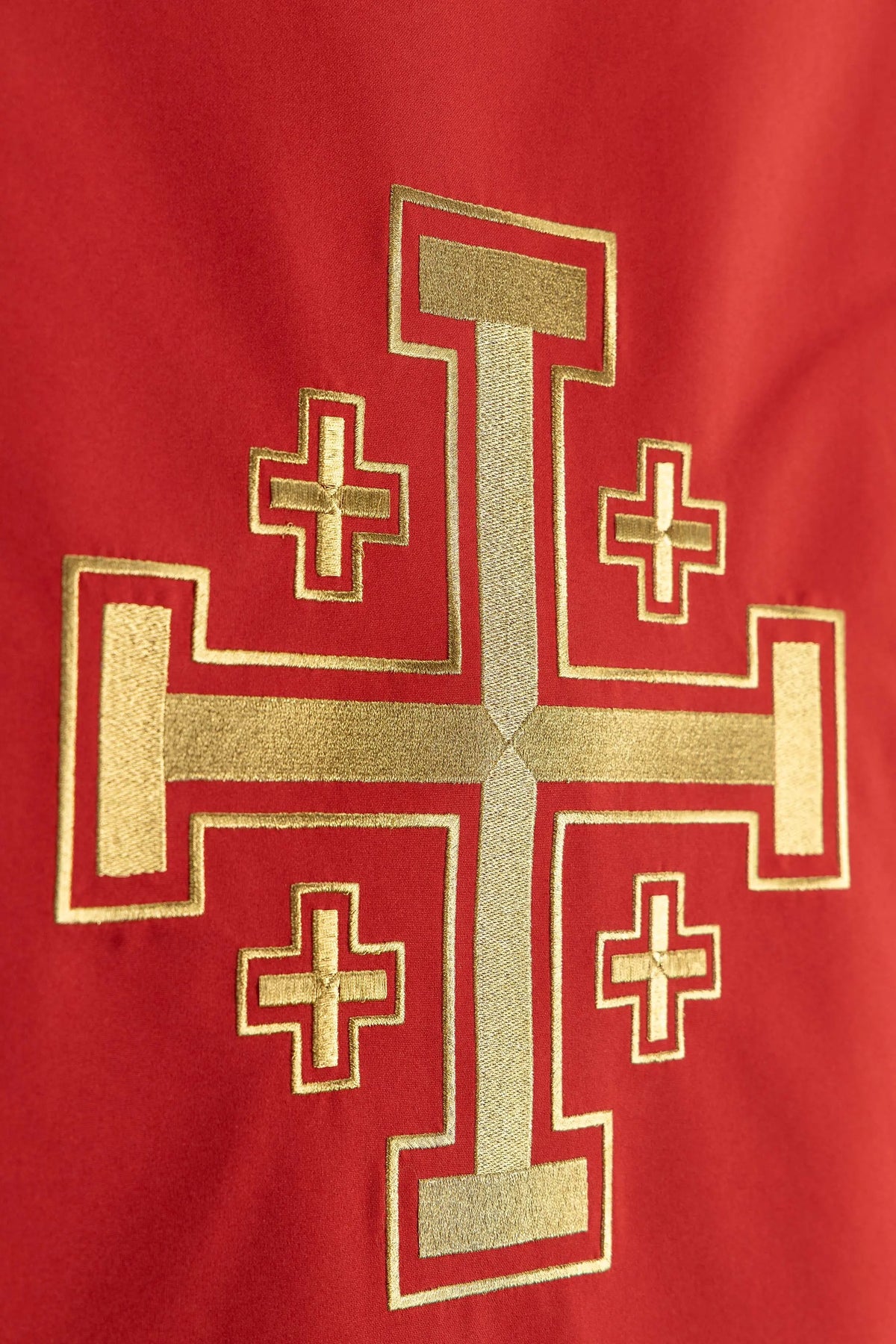 Red lectern cover with Jerusalem Cross embroidery, close-up view