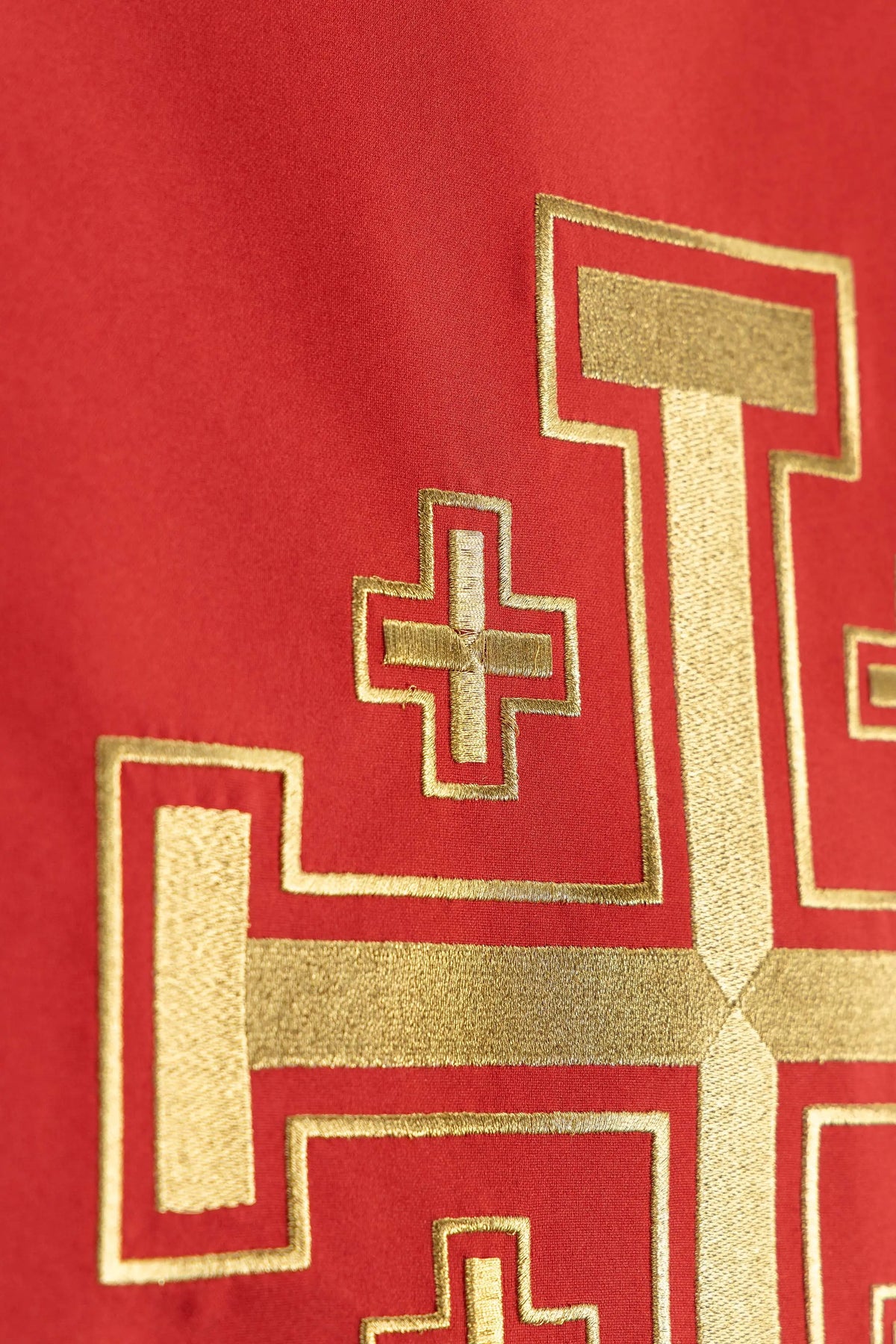 Red lectern cover with Jerusalem Cross embroidery, left detail view