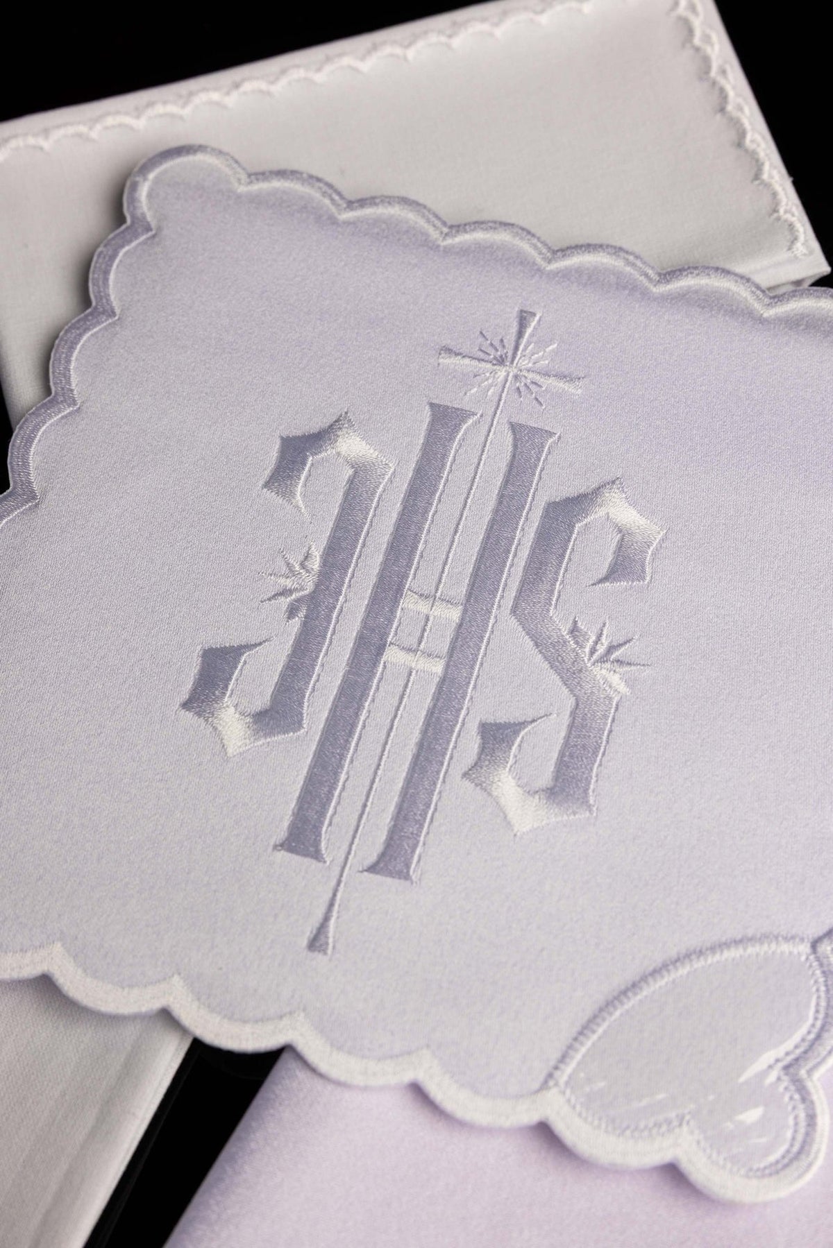 White altar linen set with IHS embroidery, close-up of scalloped edge