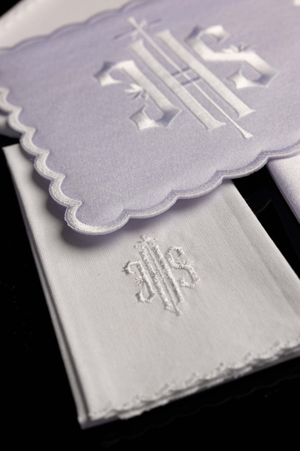 White altar linen set with IHS embroidery, detail of embroidered linen