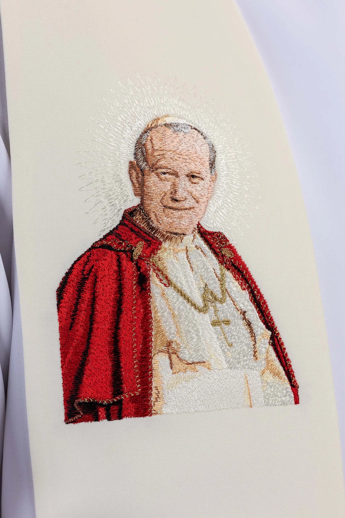Ecru stole with embroidered image of John Paul II, close-up view