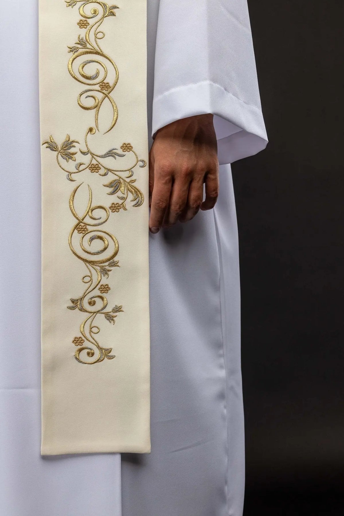 Ecru stole with gold floral scroll embroidery, close-up view