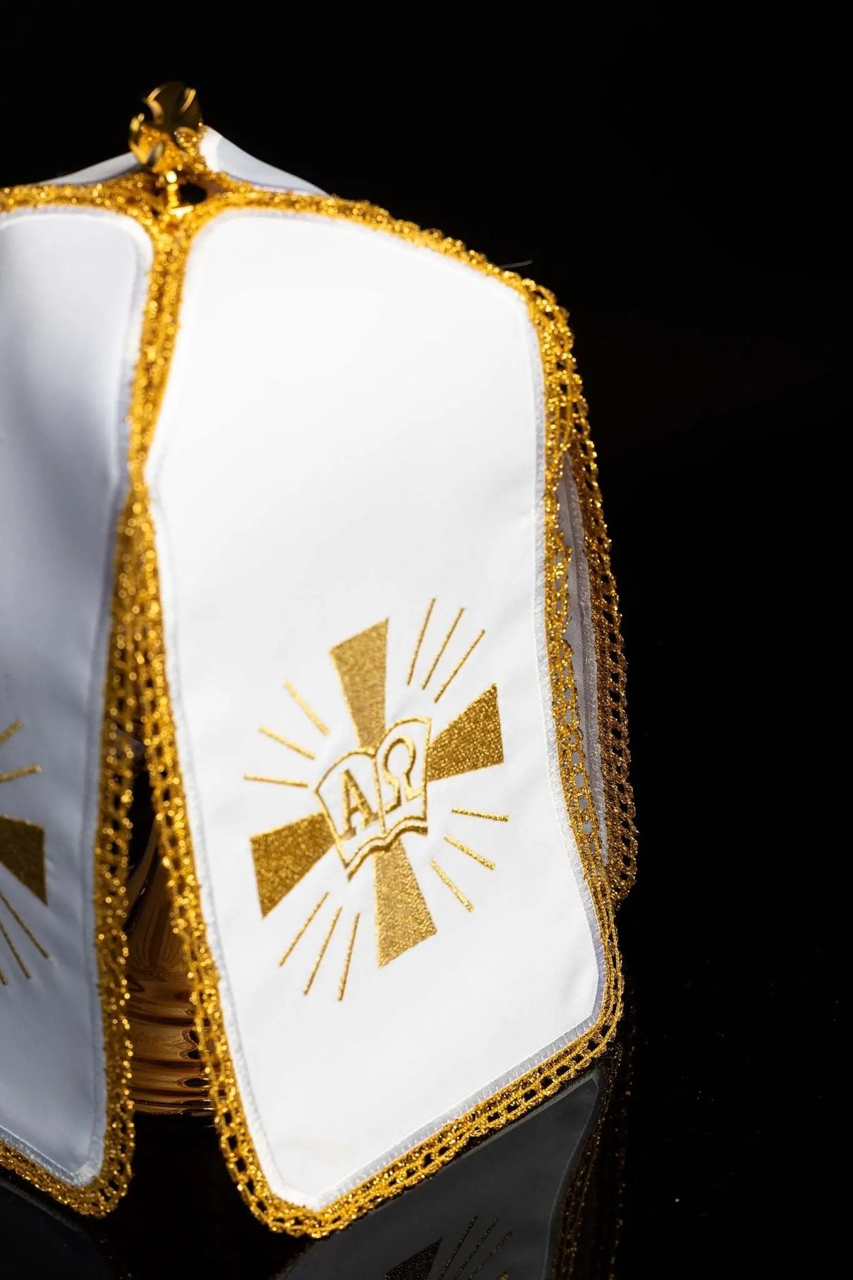 White ciborium veil with gold Alpha Omega embroidery, angled view
