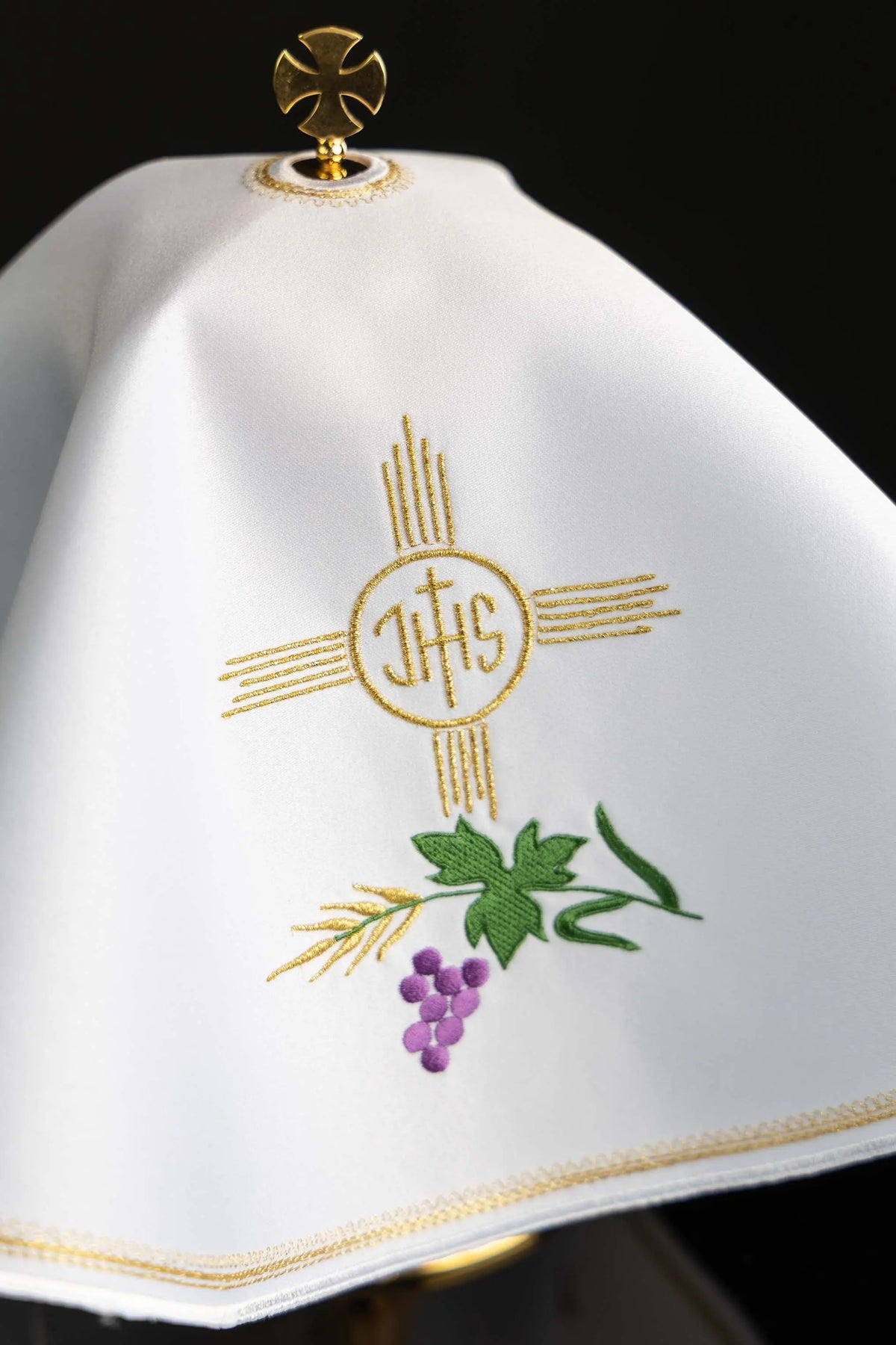 White ciborium veil with IHS, wheat, and grape embroidery, close-up