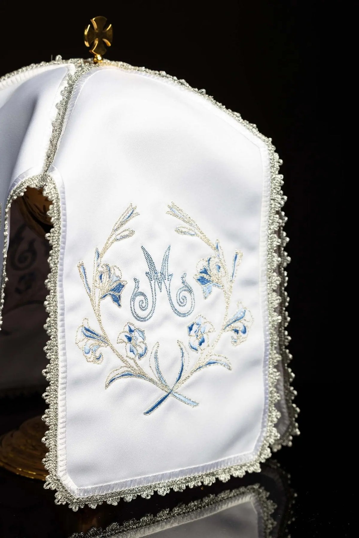 White ciborium veil with silver Marian embroidery, front view with gold cross clasp