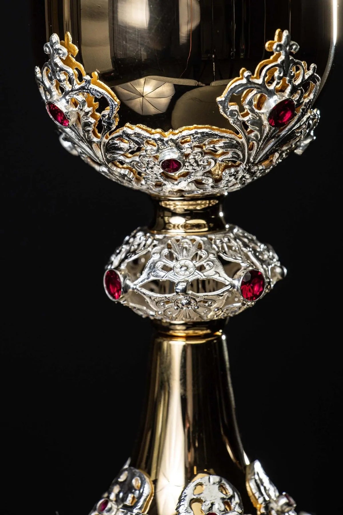 Gold chalice with openwork plant ornaments and rubies, cup and stem close-up