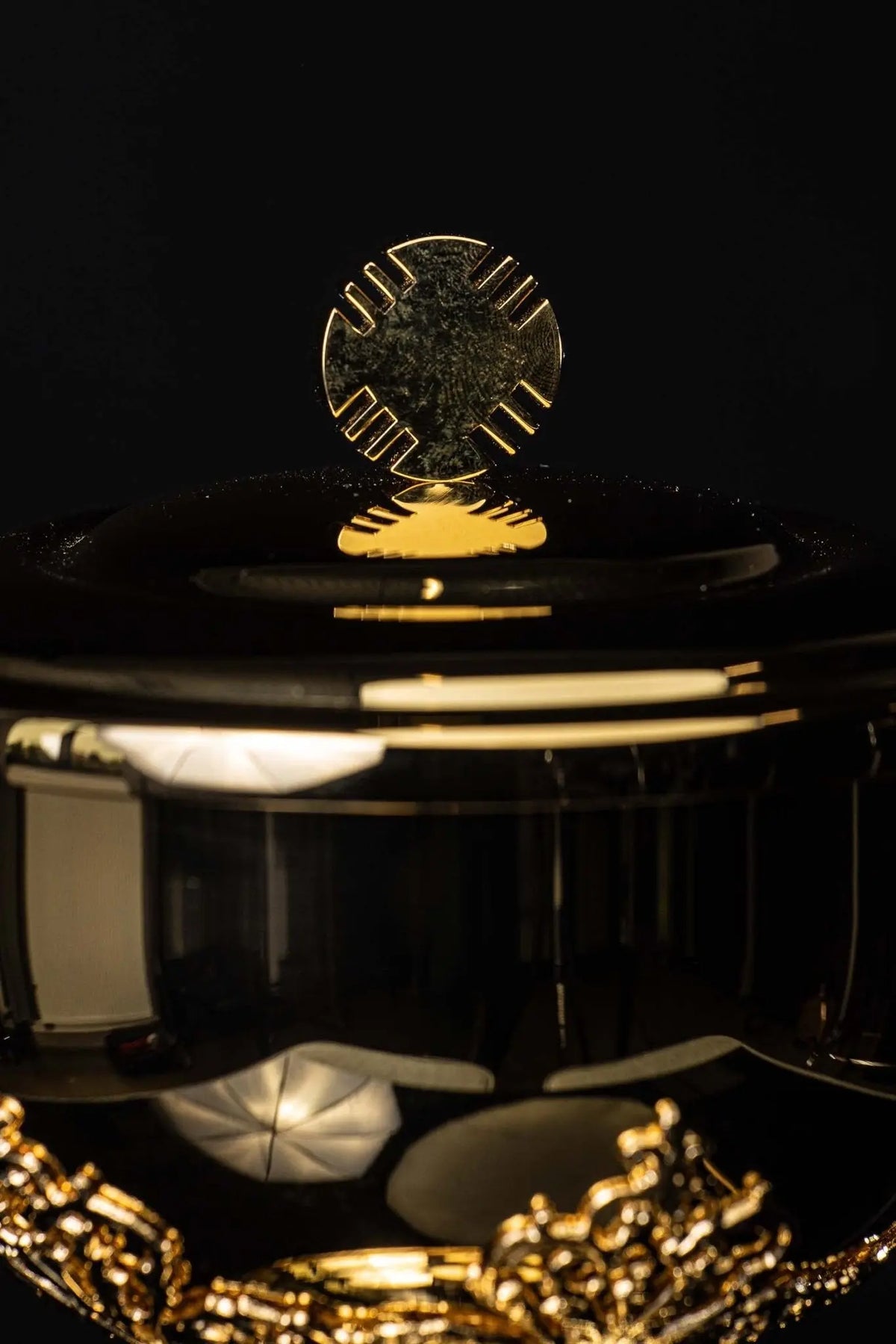 Gold ciborium with floral ornaments, close-up of the raised floral bowl ornament