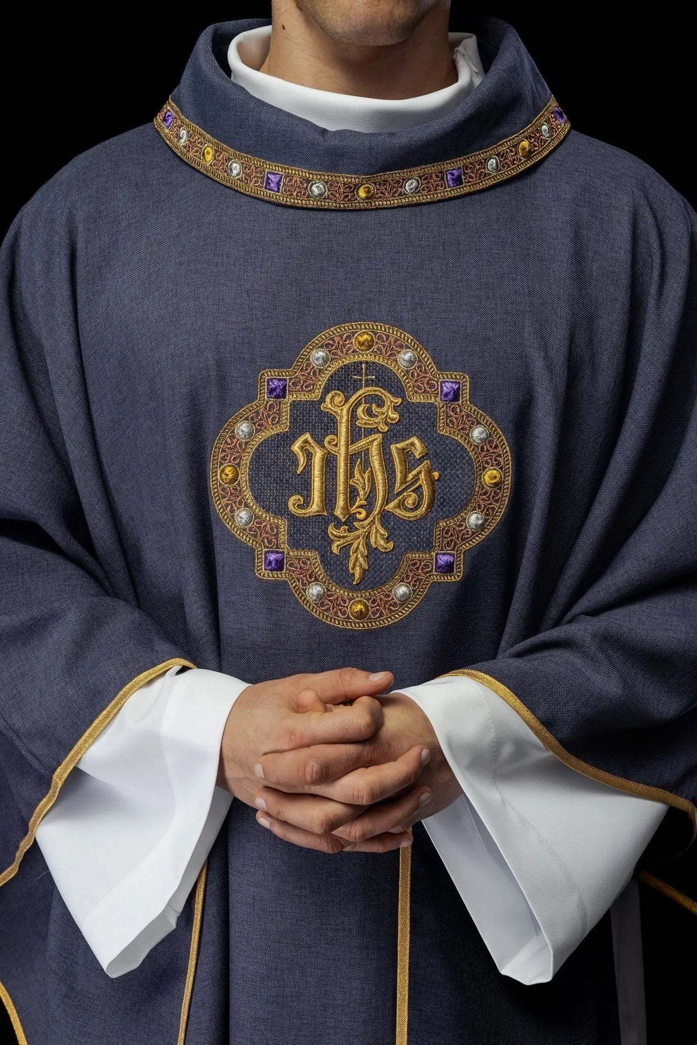 Chasuble with richly embroidered belt and piping around IHS I collar embroidery in purple color