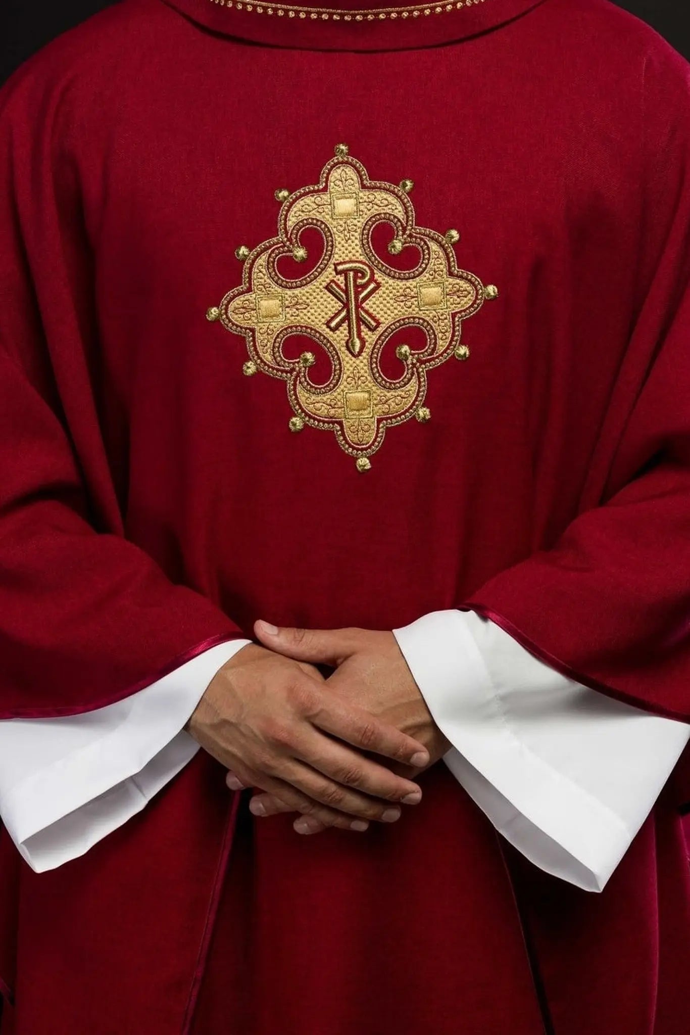 Chasuble with embroidered cross and gold trim on collar in red