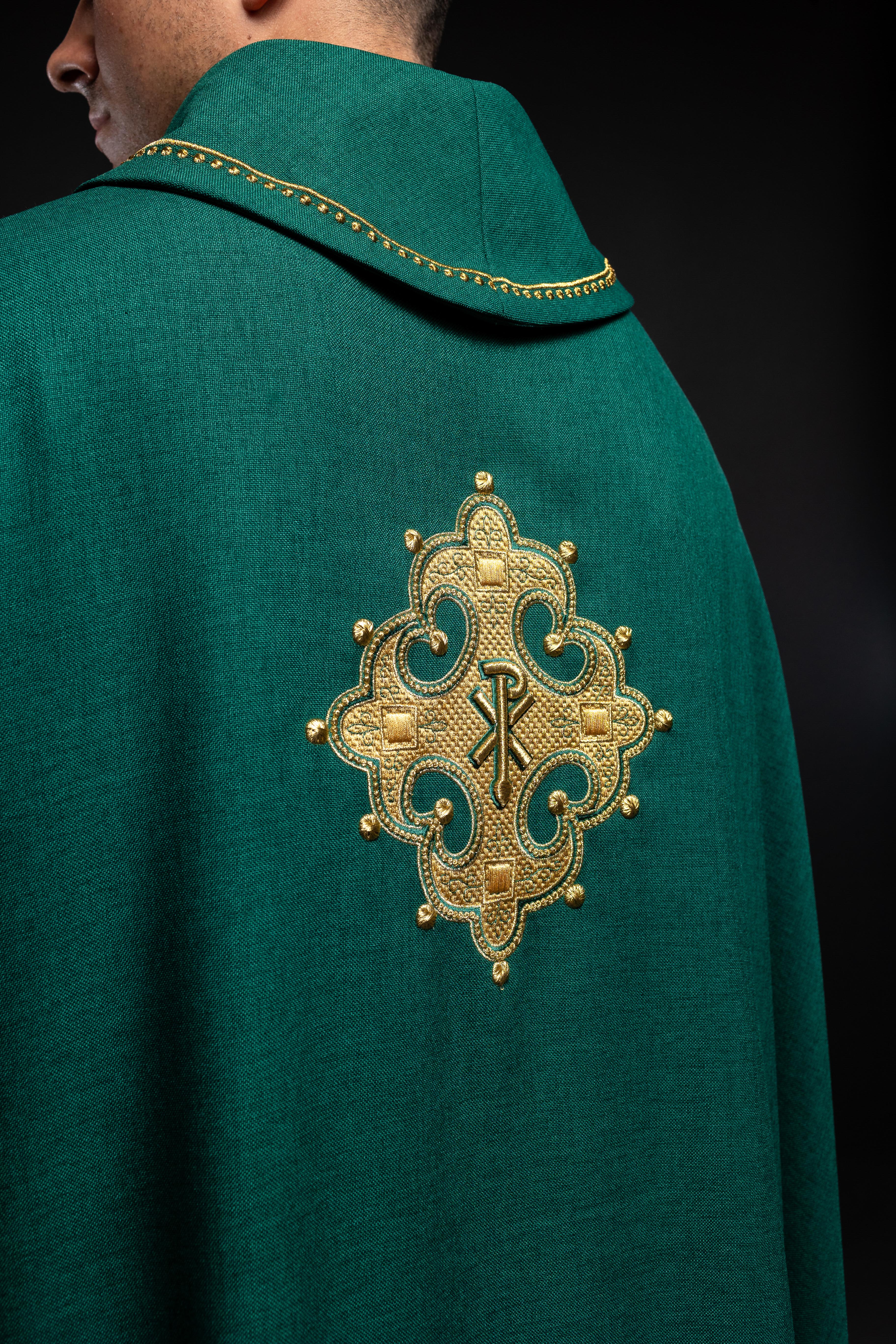 Chasuble with embroidered cross and gold trim on collar in green