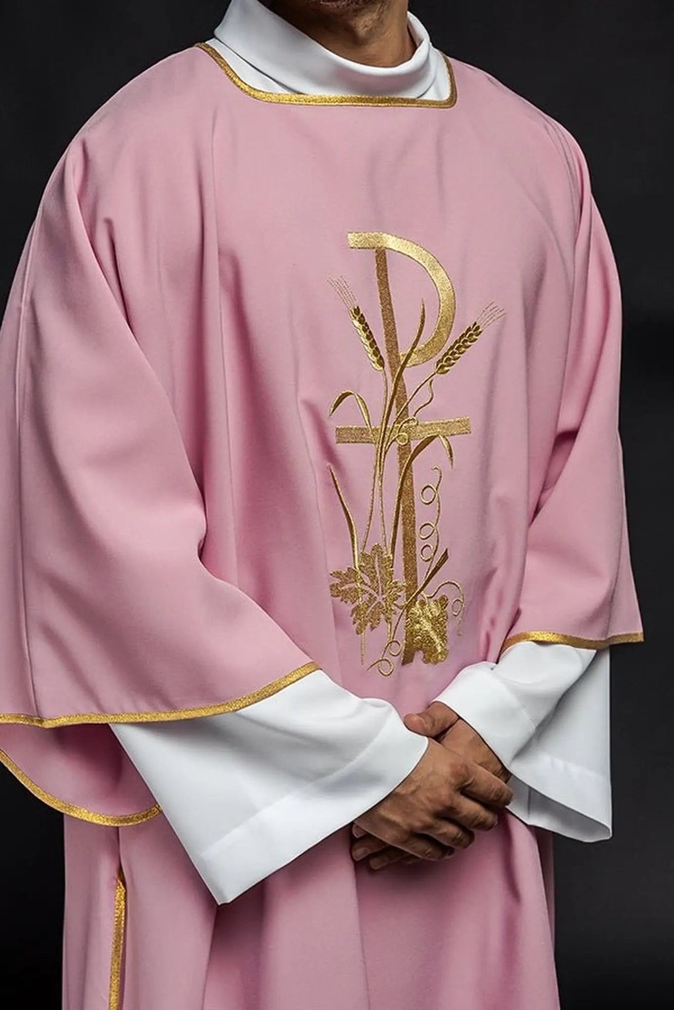 Pink dalmatica with gold Pax cross embroidery