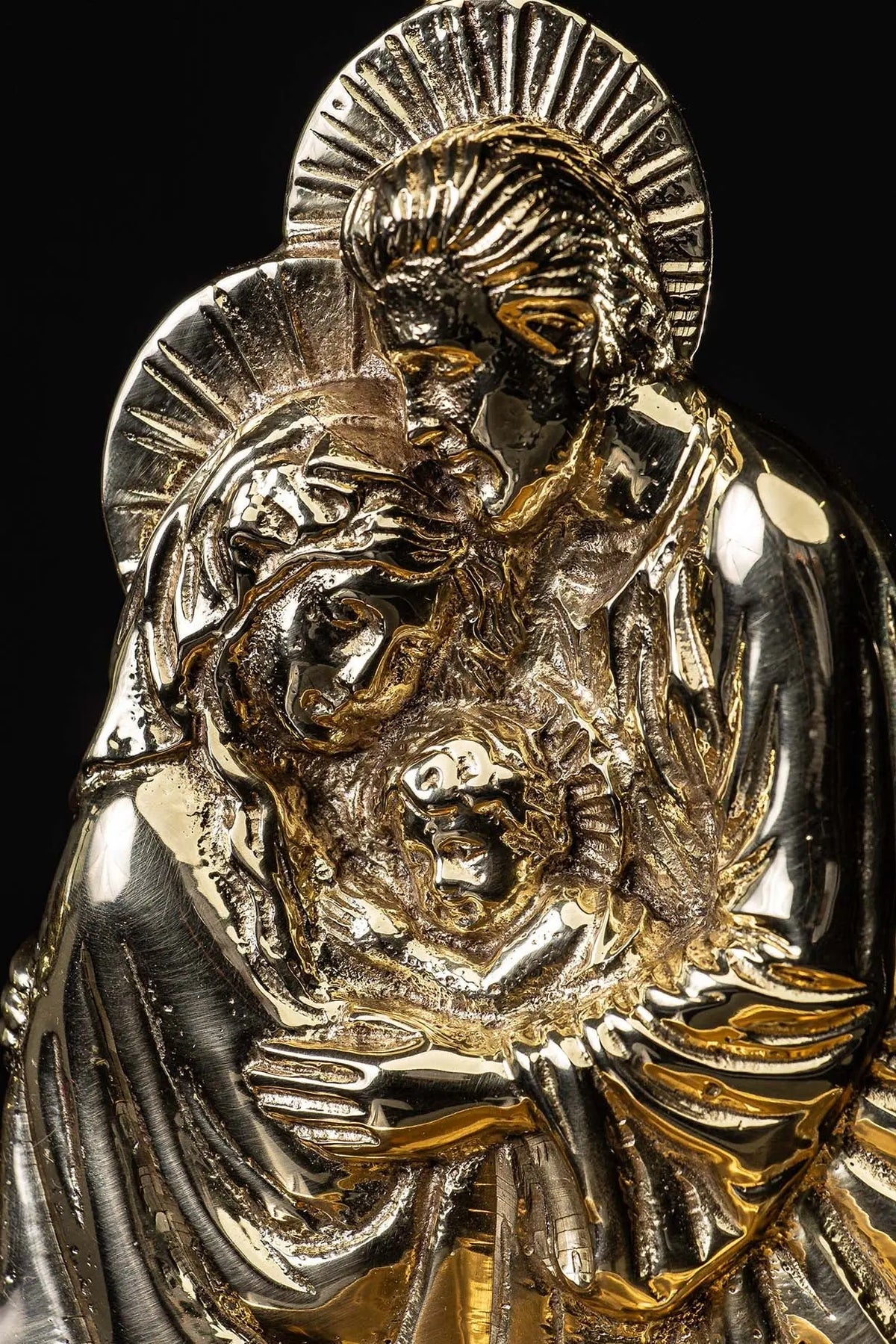 Gold and silver holy water font with the Holy Family, detail view