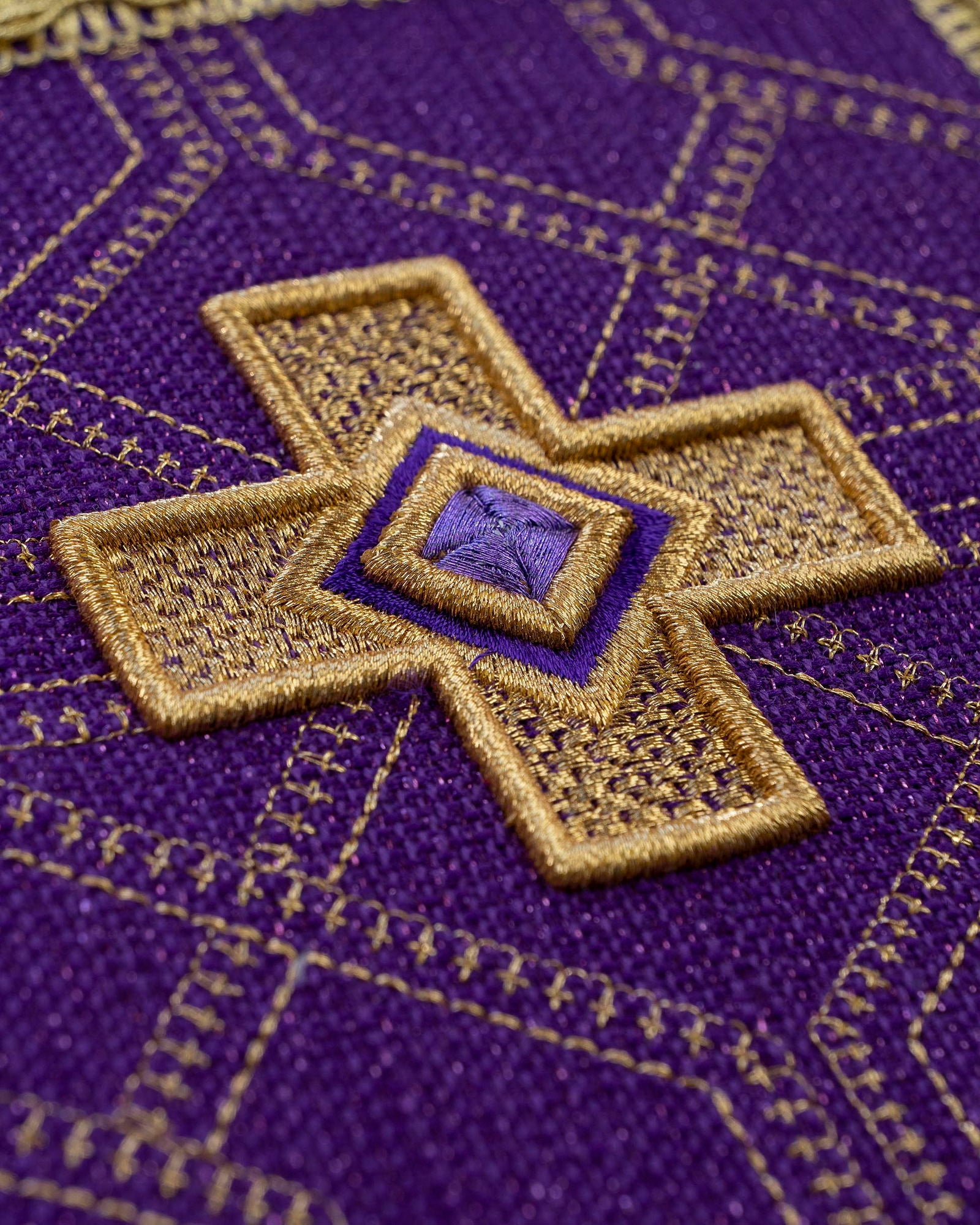 Set of four stakes with gold embroidery