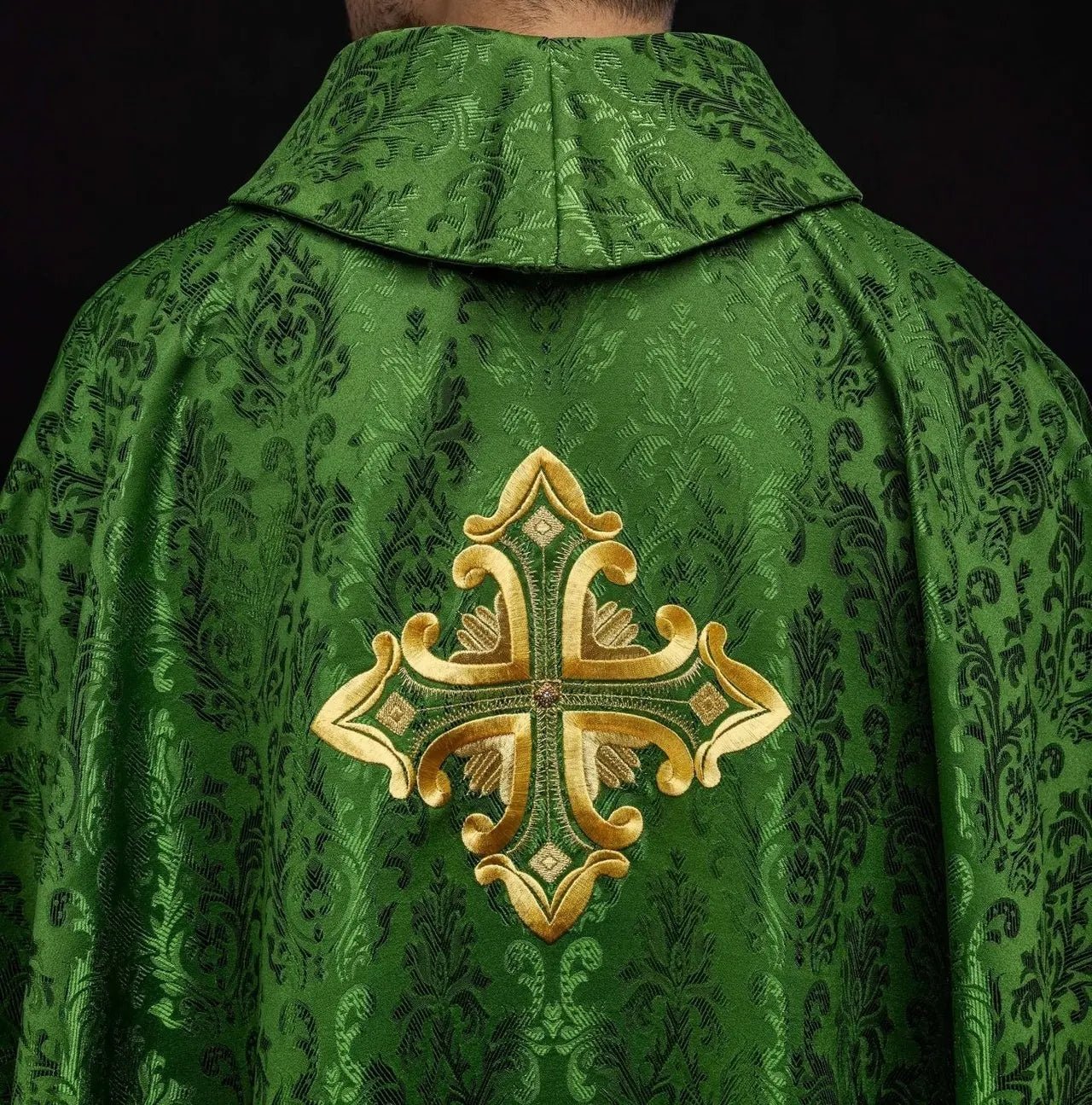 Green chasuble with cross sewn from patterned fabric